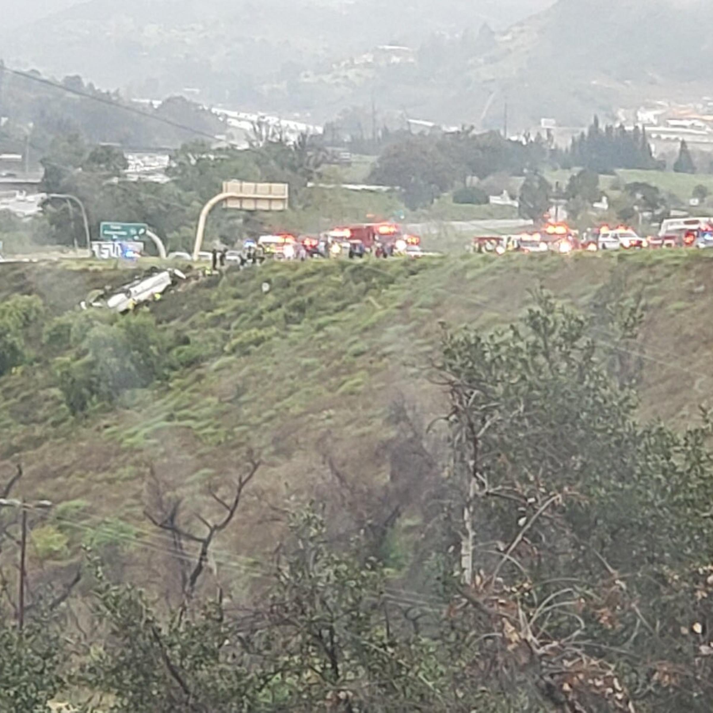 A bus rolled over on the southbound side of I-15, trapping multiple people and killing at least 3, according to officials, in Fallbrook, Calif., on Feb. 22, 2020.