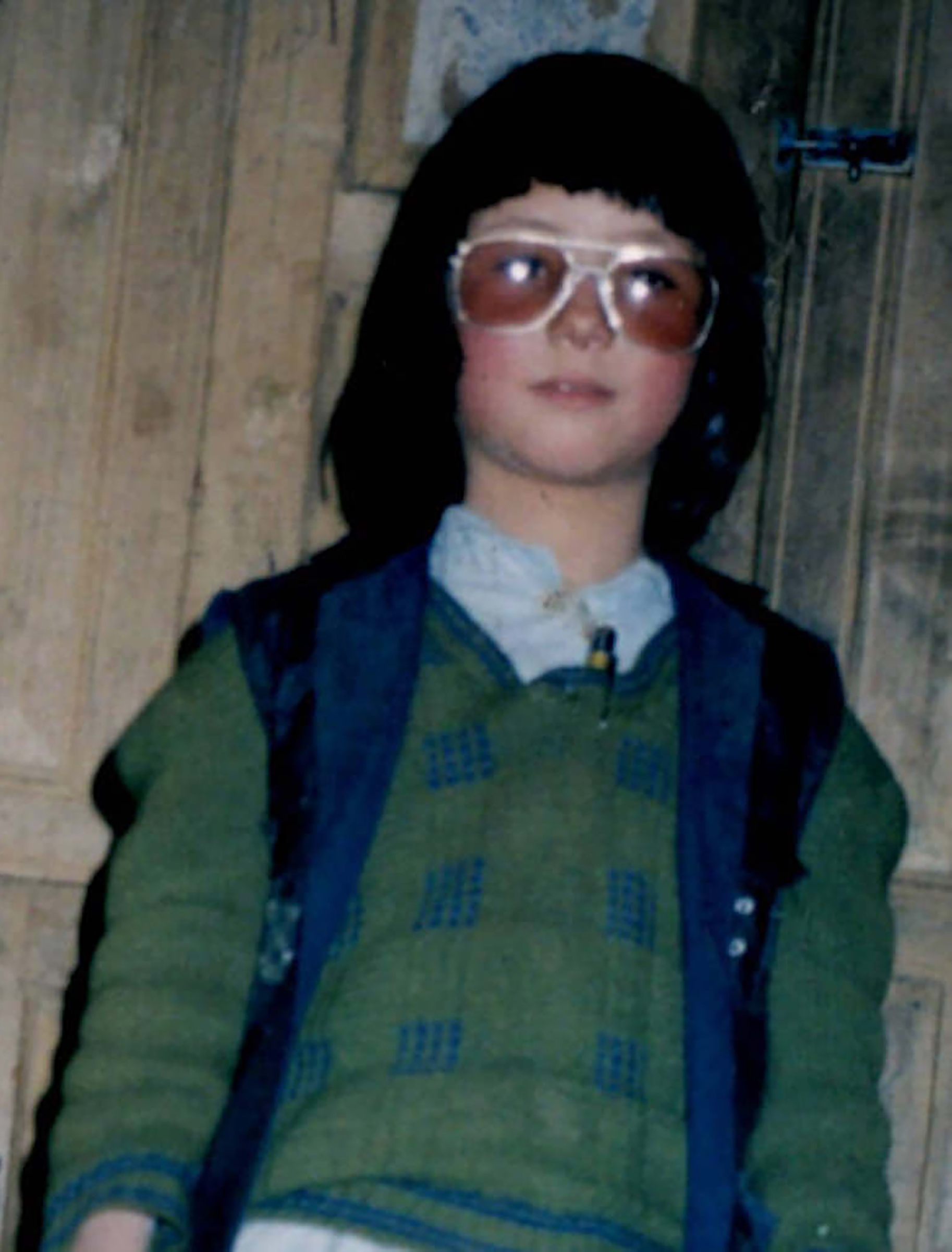Joya, dressed as a boy to go to school at age 8
