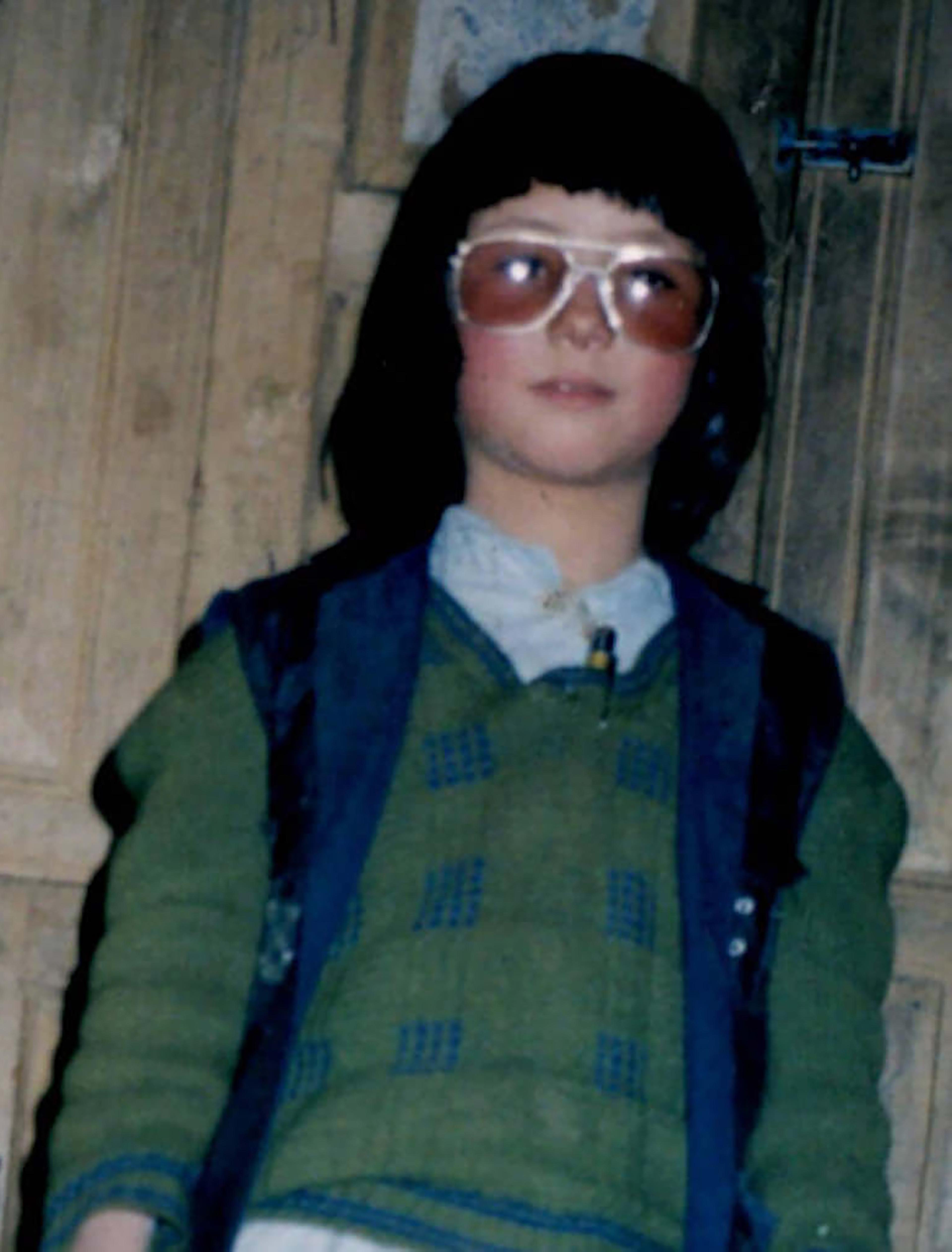 Joya, dressed as a boy to go to school at age 8