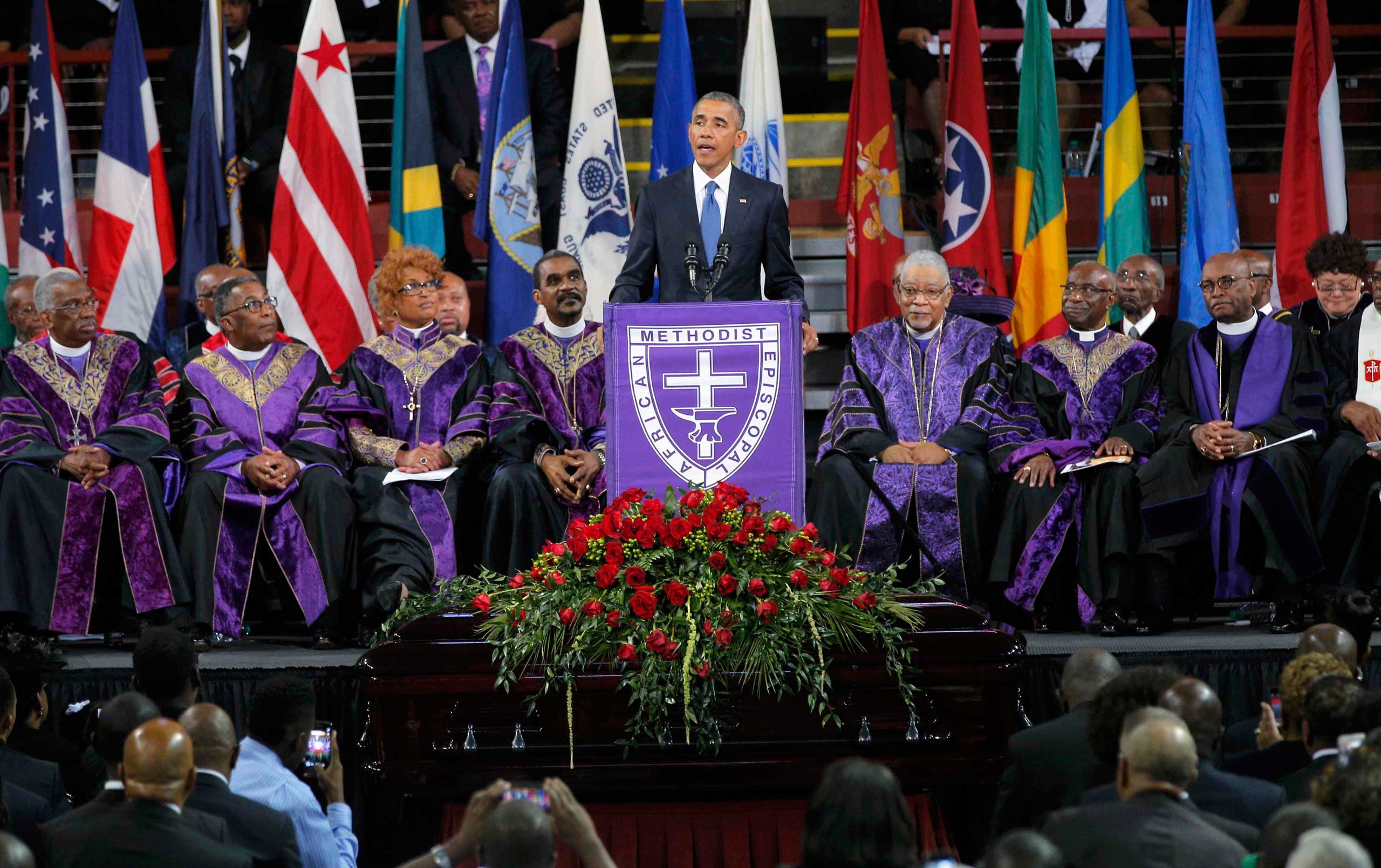 U.S. President Obama speaks behind the coffin of the Rev. Clementa Pinckney during funeral services for Pinckney in Charleston