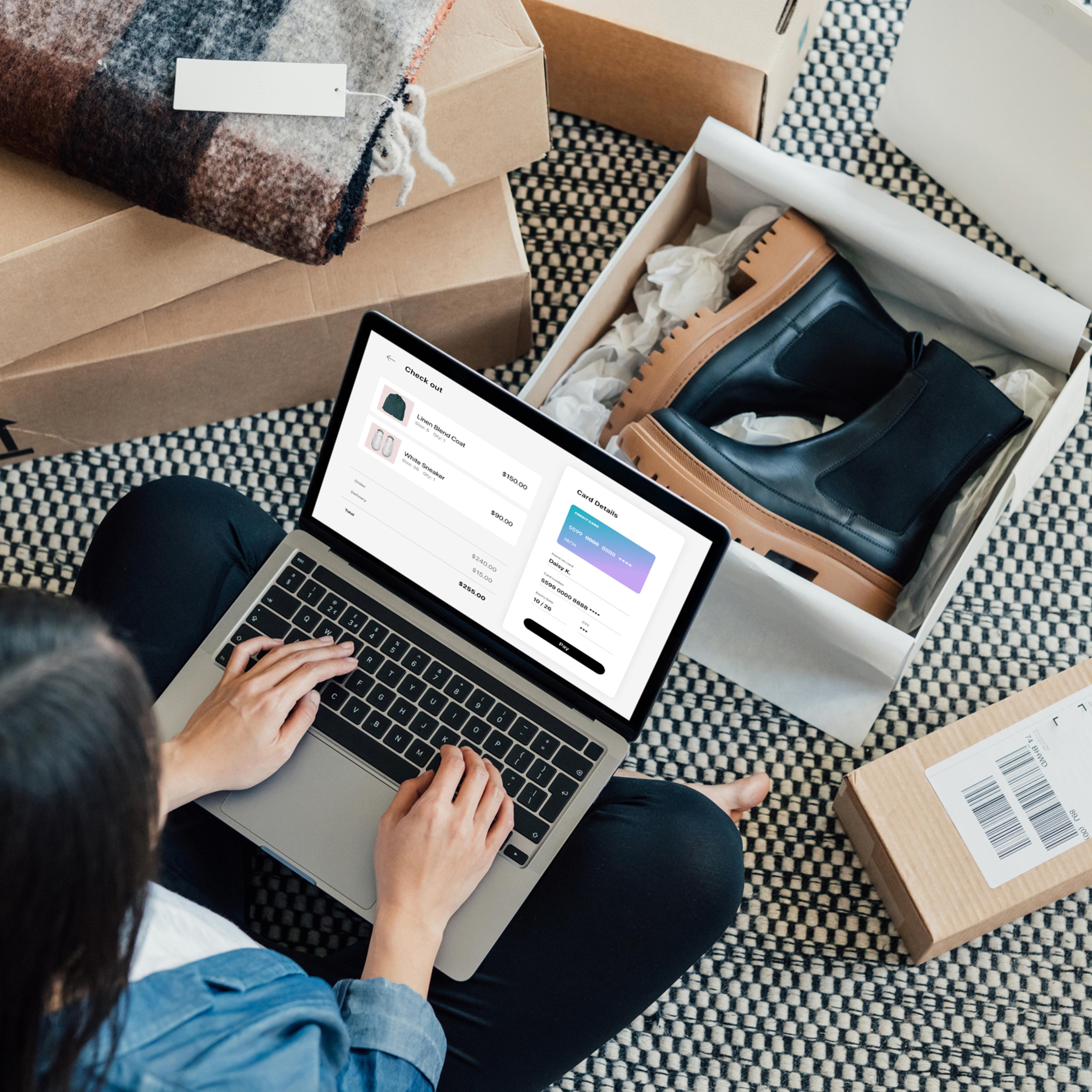 Overhead View Of Young Woman Doing Online Shopping With Laptop