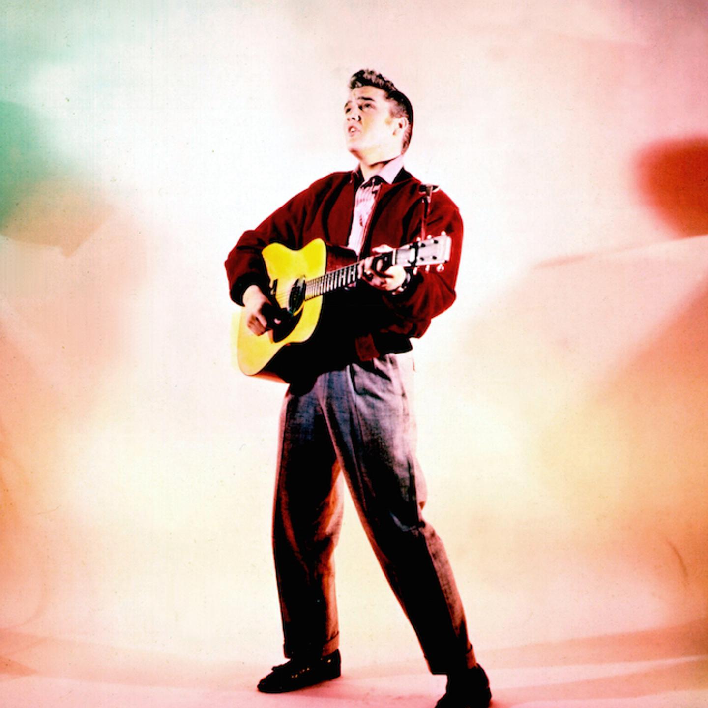 Elvis Presley with his guitar