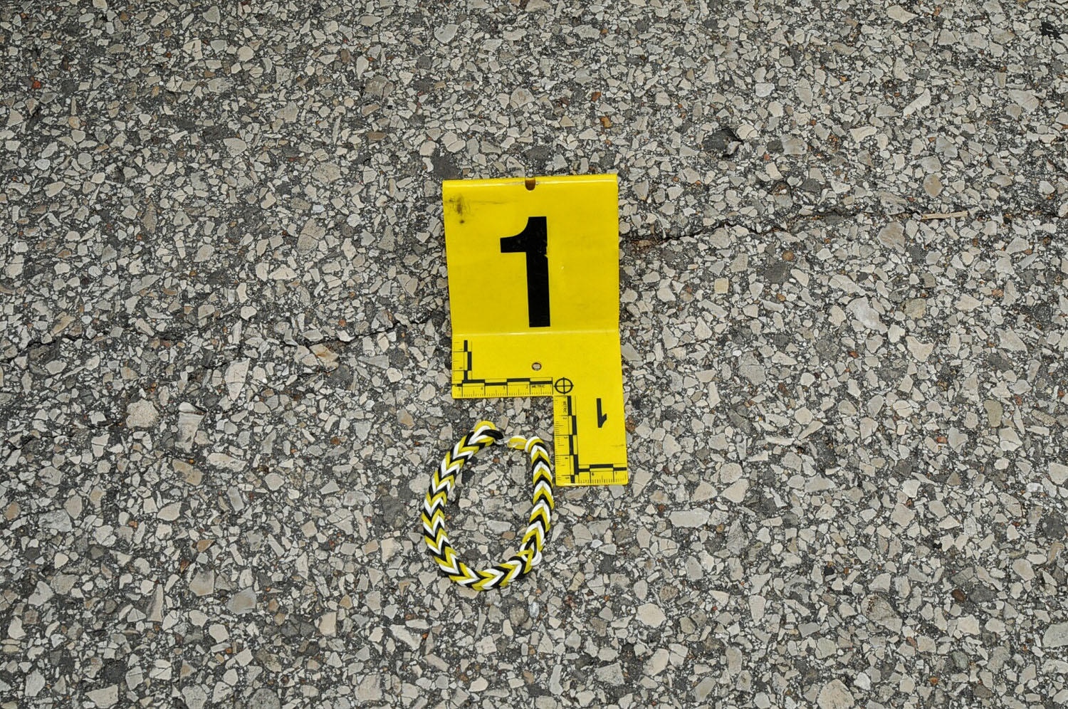 An undated evidence photograph made available by the St. Louis County prosecutors office on Nov. 25, 2014 shows a bracelet that was found on the ground near Ferguson Police officer Darren Wilson's vehicle in August 2014.