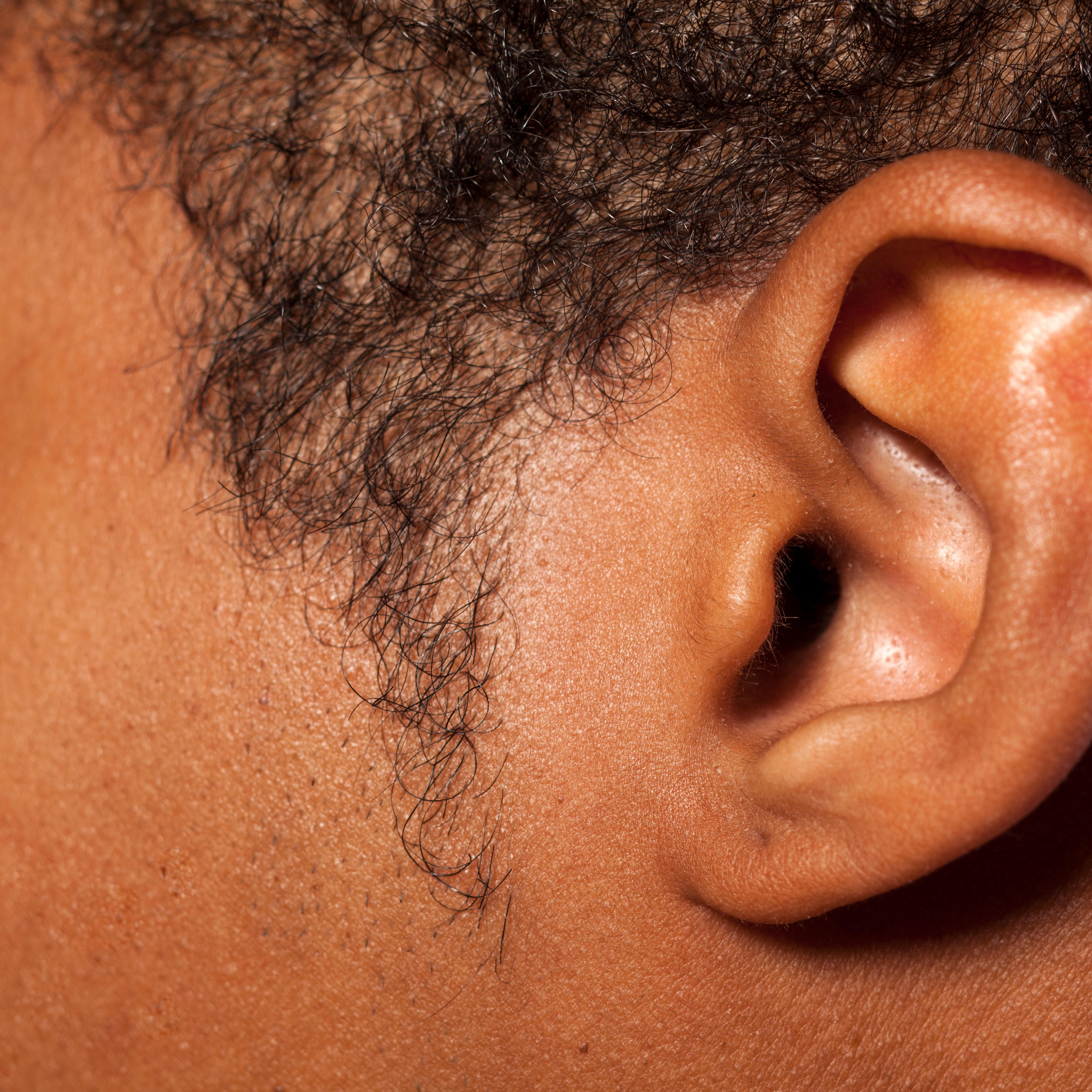 Ear of a dark-skinned young man