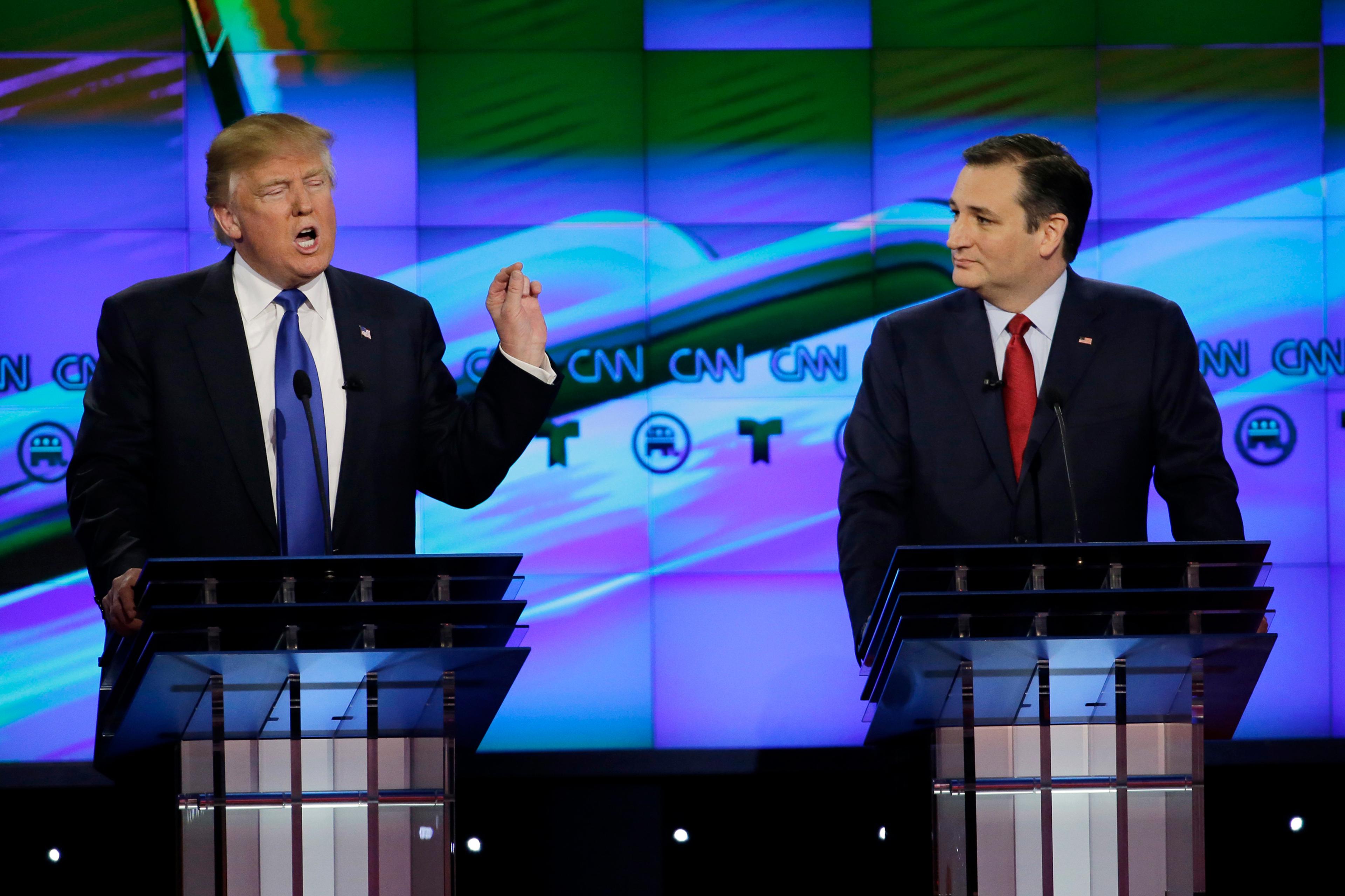 FILE - In this Feb. 25, 2016 file photo, Sen. Ted Cruz, R-Texas listen as Donald Trump speaks during a Republican presidential primary debate at The University of Houston in Houston. Cruz announced Friday, Sept. 23, 2016, he will vote for Donald Trump, a