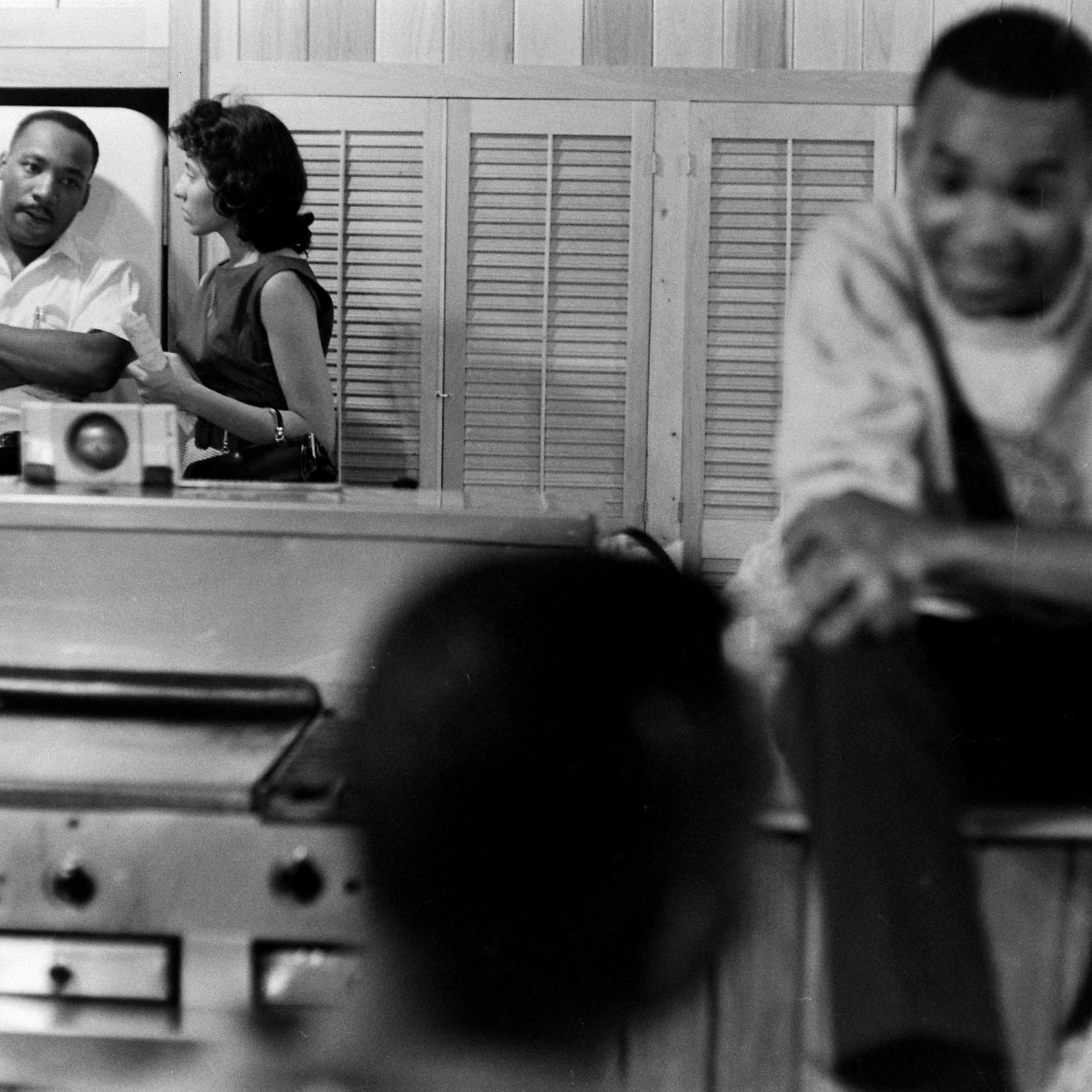 Freedom riders, along with Martin Luther King Jr., relax at a safe house in Montgomery, Ala.