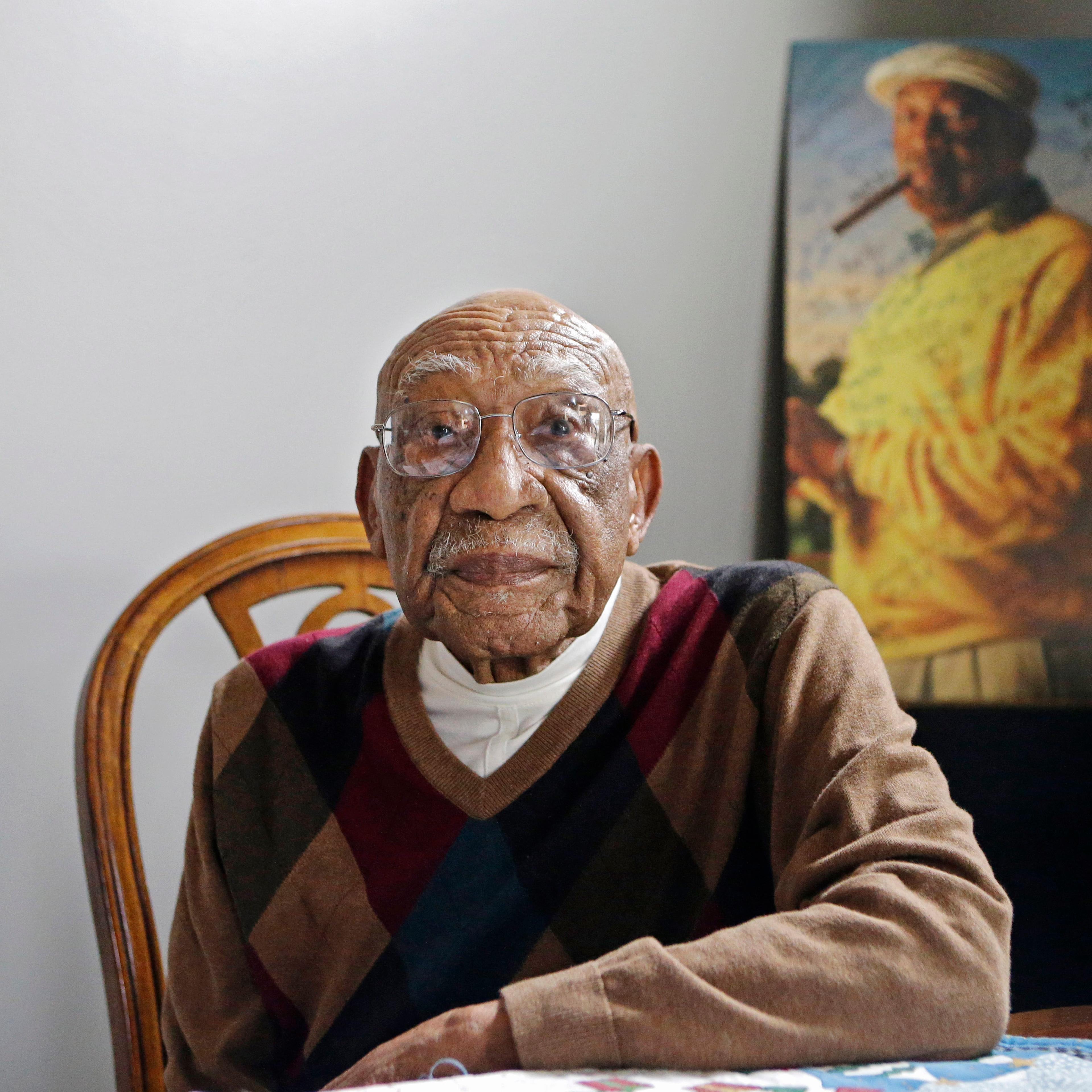 Former PGA golfer Charlie Sifford sits in the dining room of his home in Brecksville, Ohio on Nov. 13, 2014