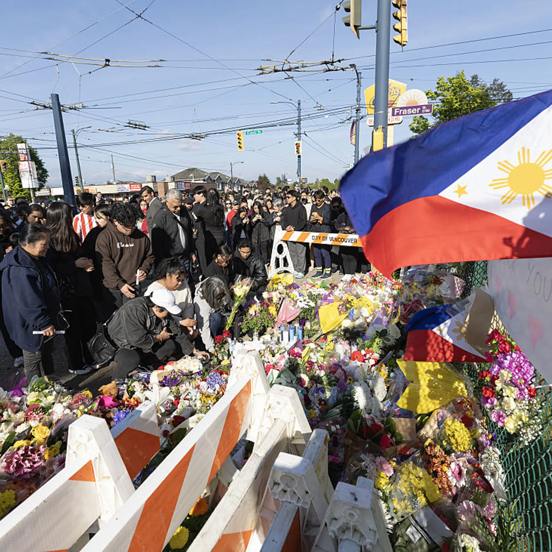 People attend a candlelight vigil near the scene where a car drove into a crowd at the Lapu-Lapu Festival on April 27, 2025 in Vancouver, Canada.