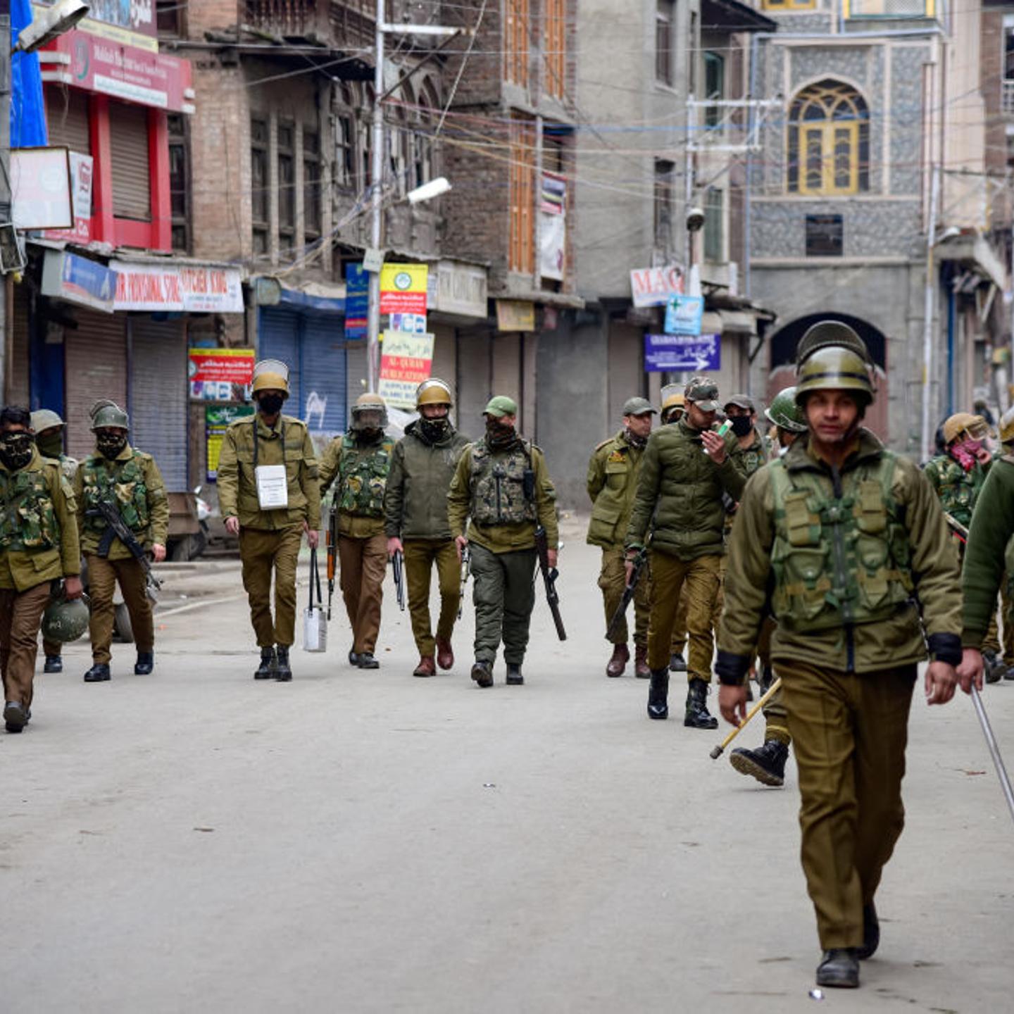 Indian policemen are seen patrolling during the clashes in
