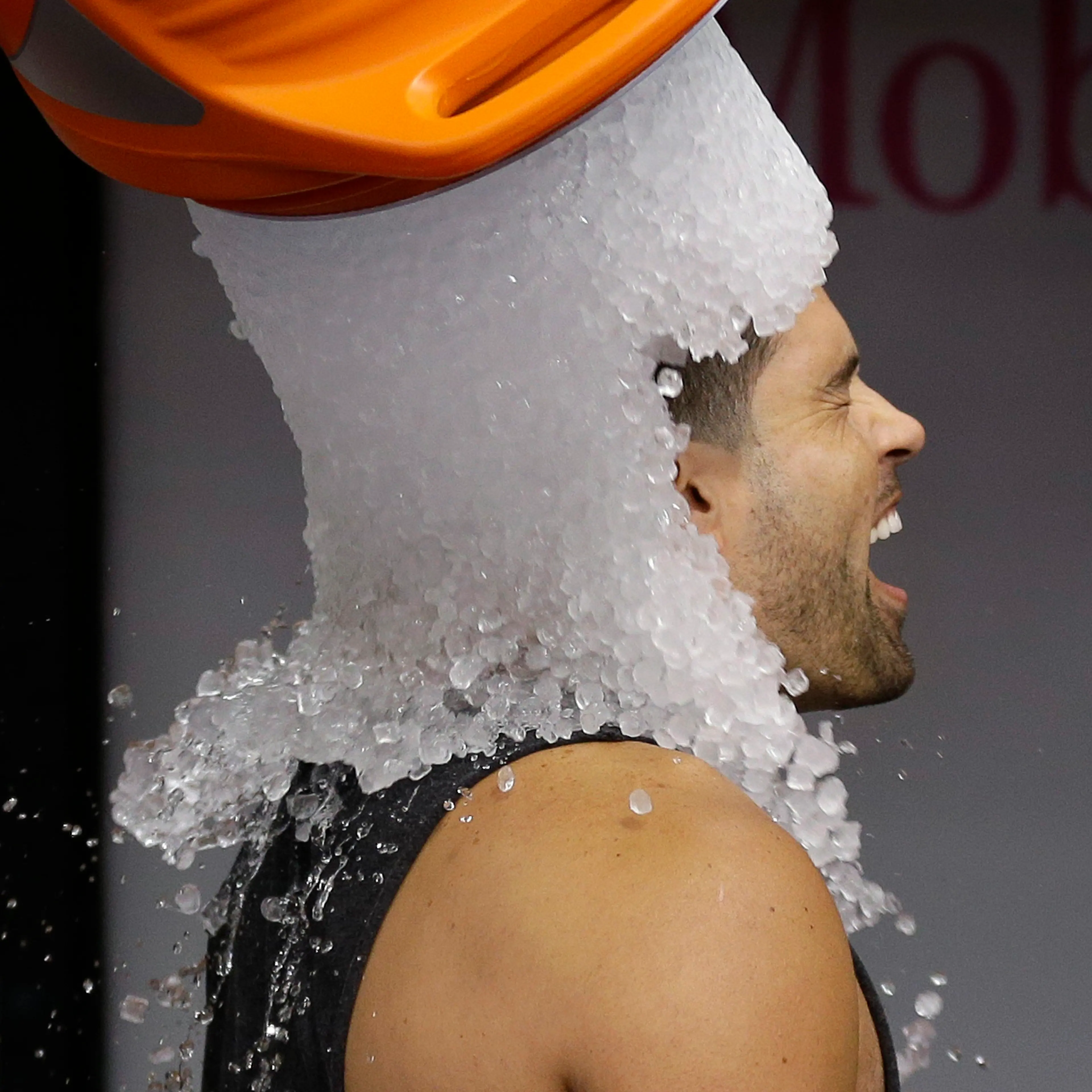 Tampa Bay Rays' David DeJesus gets a bucket of ice dumped on his head from video coordinator Chris Fernandez as part of the ALS Ice Bucket Challenge before a baseball game against the New York Yankees on Aug. 17, 2014, in St. Petersburg, Fla.