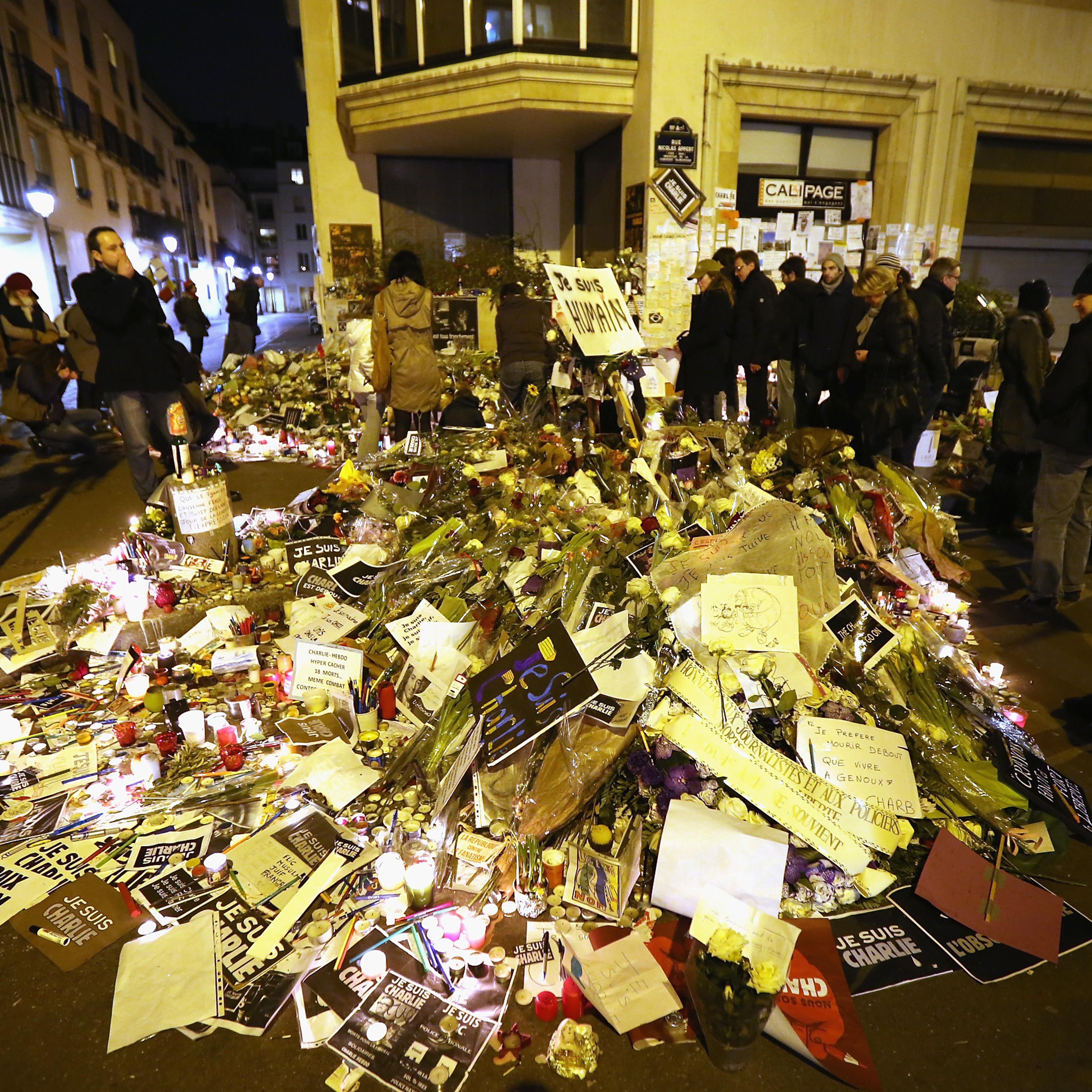 Remembrance: Tributes mounted outside the Charlie Hebdo office after the Jan. 11 unity parade in Paris