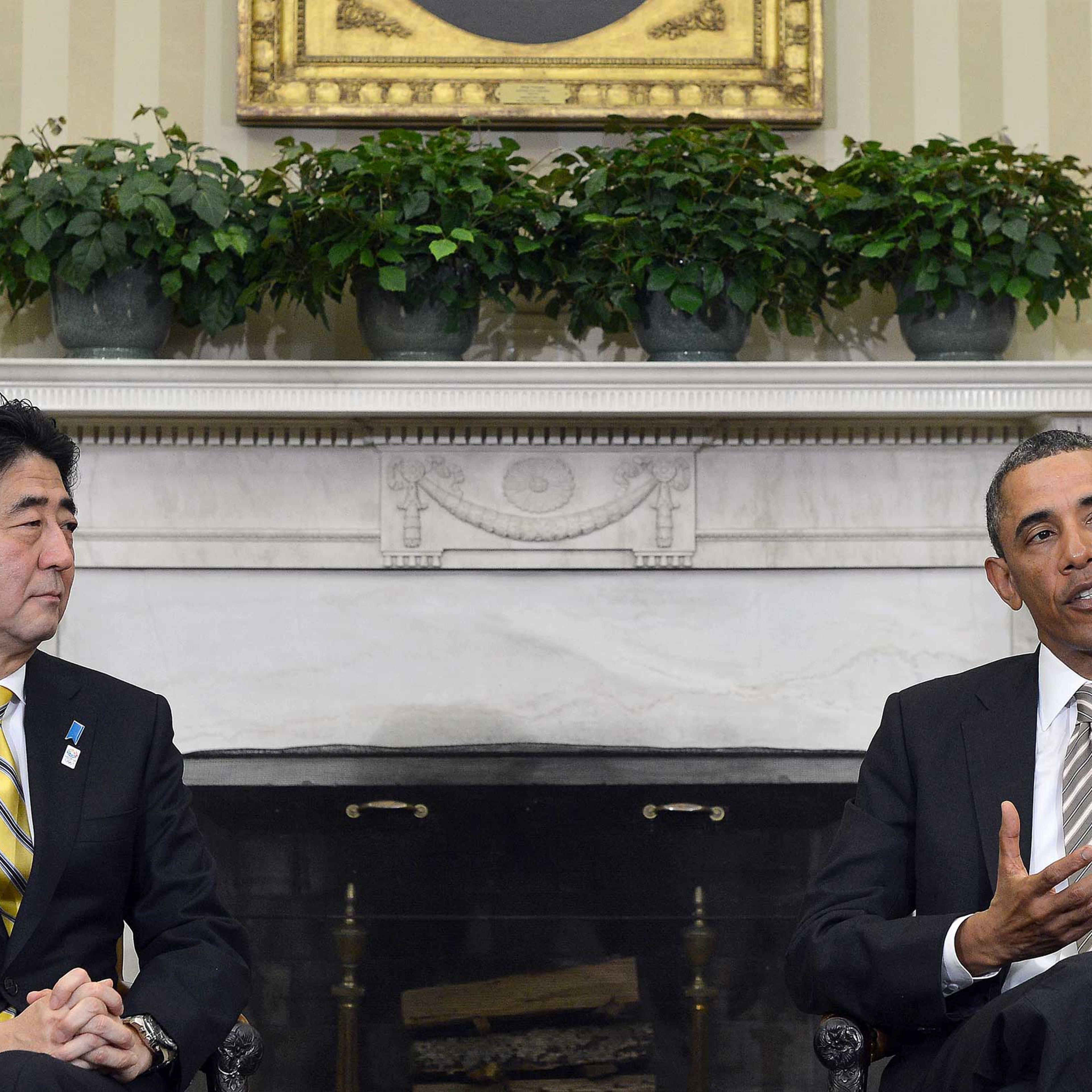 US President Barack Obama speaks while Japan's new conservative Prime Minister Shinzo Abe listens, following their bilateral meeting in the Oval Office at the White House in Washington, DC, on Feb. 22, 2013.