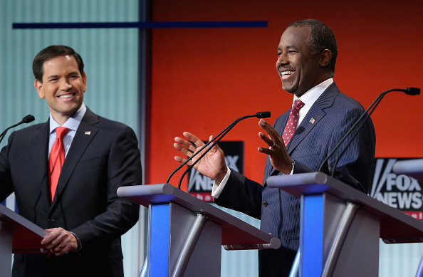 Republican presidential candidates Sen. Marco Rubio (R-FL) (L) and Ben Carson participate in the first prime-time presidential debate hosted by FOX News and Facebook at the Quicken Loans Arena August 6, 2015 in Cleveland, Ohio.