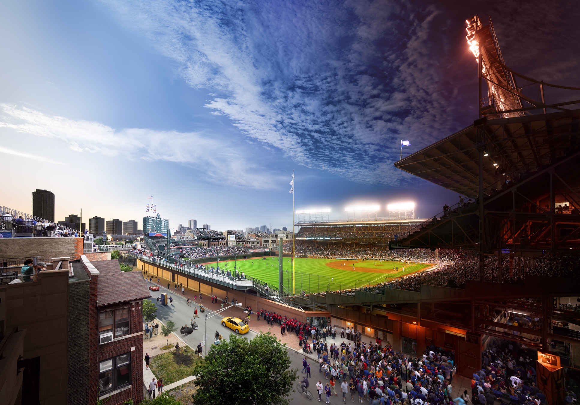 <i><b>In each caption, Stephen Wilkes shares his thoughts on each of his iconic cityscapes.</b></i><br /><br />
<i>Wrigley Field, Chicago, 2013</i><br /><br />
This photograph was taken during the course of a Day/Night double header, a rare occurrence these days
in major league baseball. Wrigley Field is the Grand Temple of baseball parks. It will change dramatically
within the next year, as large jumbotrons will be installed into the stadium, forever changing this view.
While the morning was sunny and clear, the afternoon made for a real challenge photographically. We had
rain showers on and off throughout the day, and into the evening.