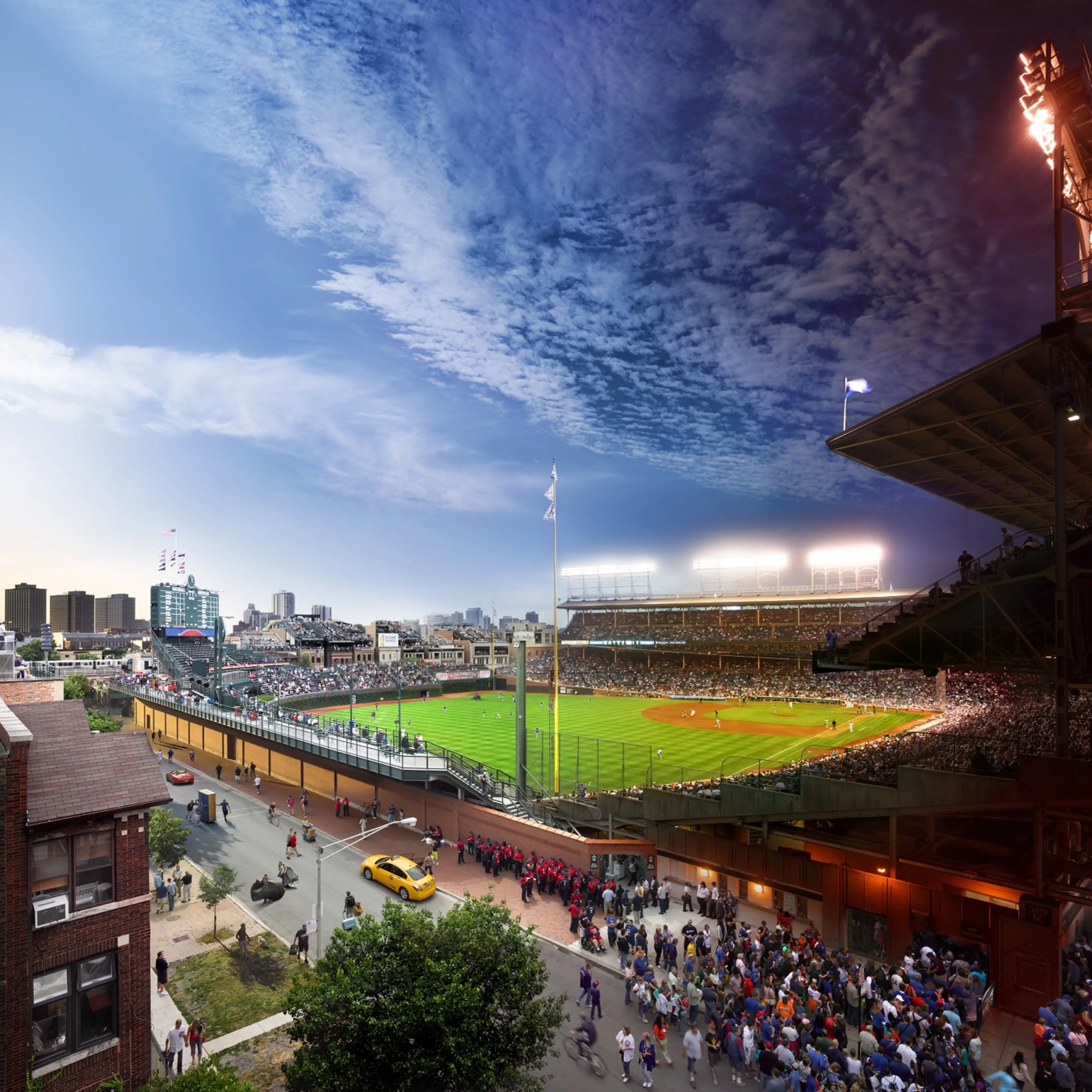 <i><b>In each caption, Stephen Wilkes shares his thoughts on each of his iconic cityscapes.</b></i><br /><br />
<i>Wrigley Field, Chicago, 2013</i><br /><br />
This photograph was taken during the course of a Day/Night double header, a rare occurrence these days
in major league baseball. Wrigley Field is the Grand Temple of baseball parks. It will change dramatically
within the next year, as large jumbotrons will be installed into the stadium, forever changing this view.
While the morning was sunny and clear, the afternoon made for a real challenge photographically. We had
rain showers on and off throughout the day, and into the evening.