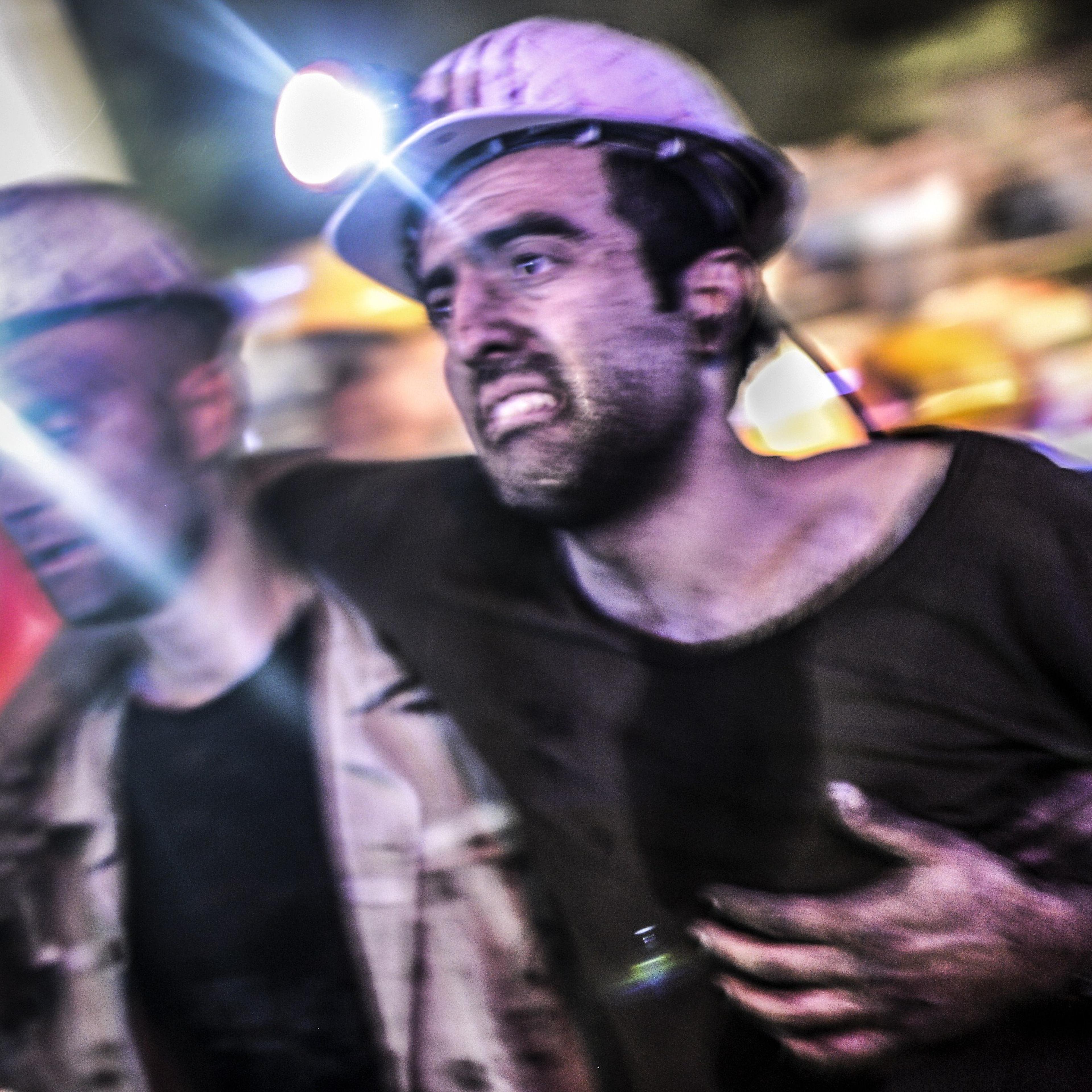 An injured miner came out carried by rescuers, on May 13, 2014 after an explosion in a coal mine in Manisa.