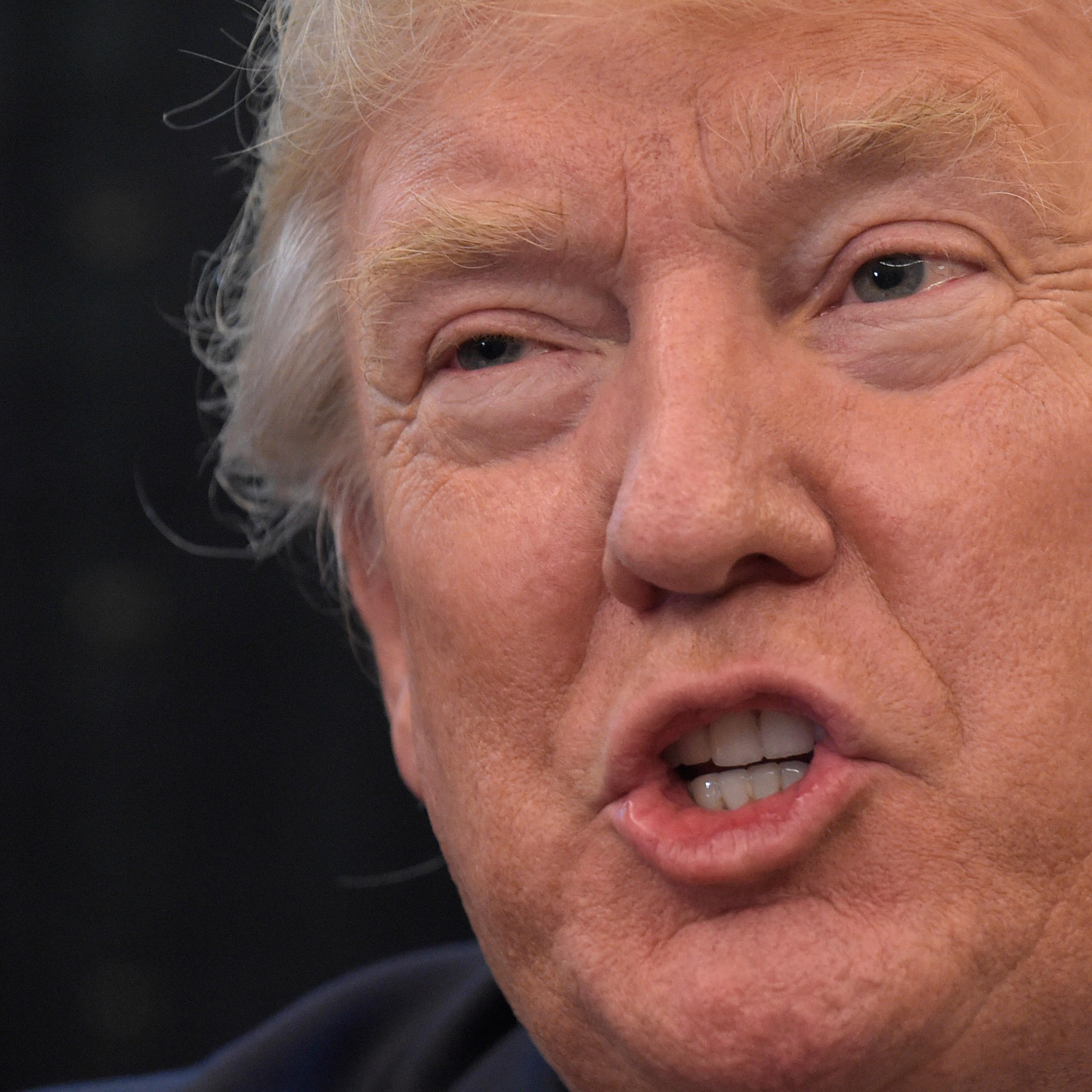 President Donald Trump answers a question about health care during a meeting with the 2016 World Series Champions Chicago Cubs, June 28, 2017, in the Oval Office of the White House in Washington.