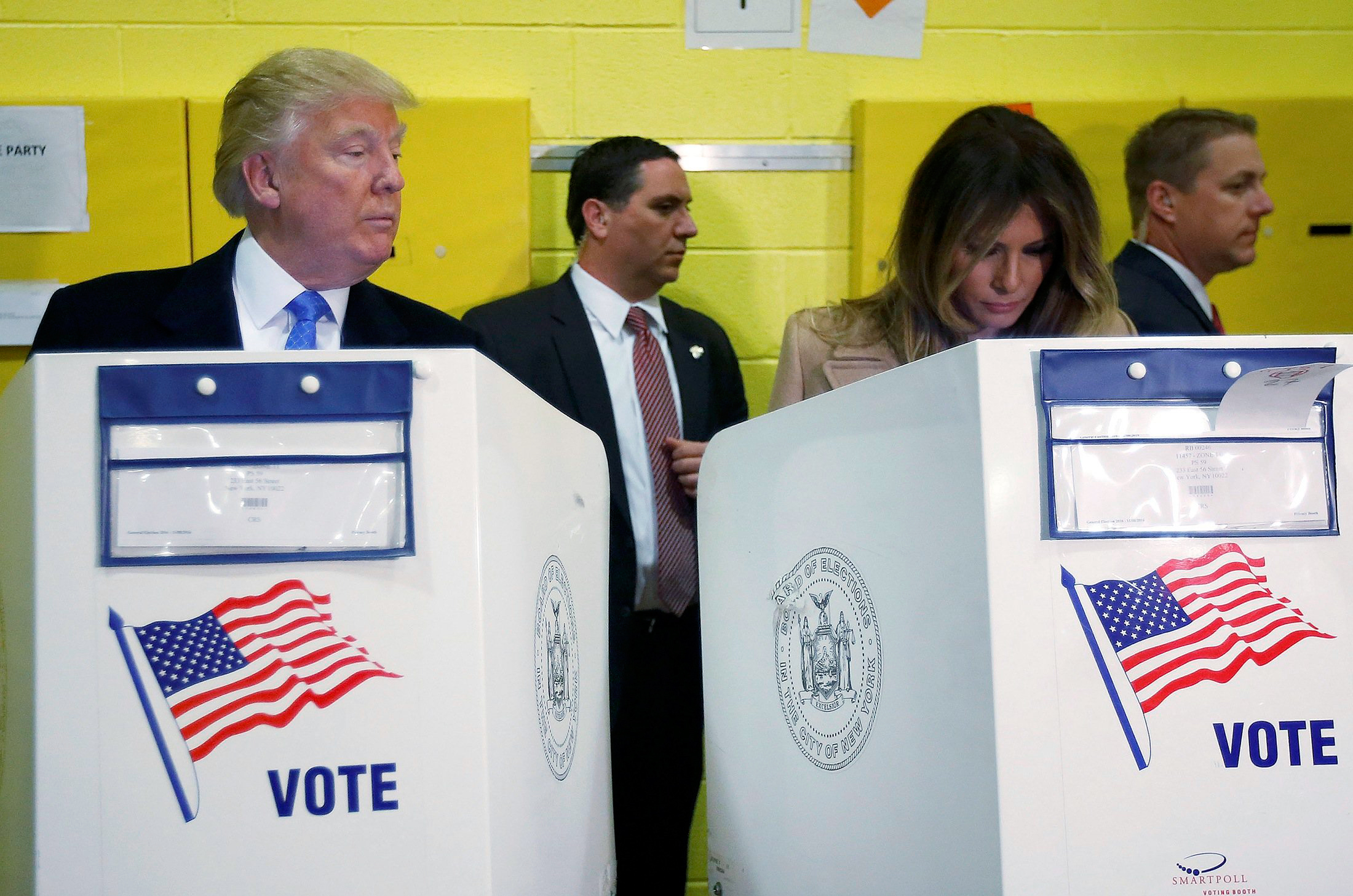 Republican presidential nominee Donald Trump and his wife Melania Trump vote at PS 59 in New York, New York, U.S. November 8, 2016.   REUTERS/Carlo Allegri