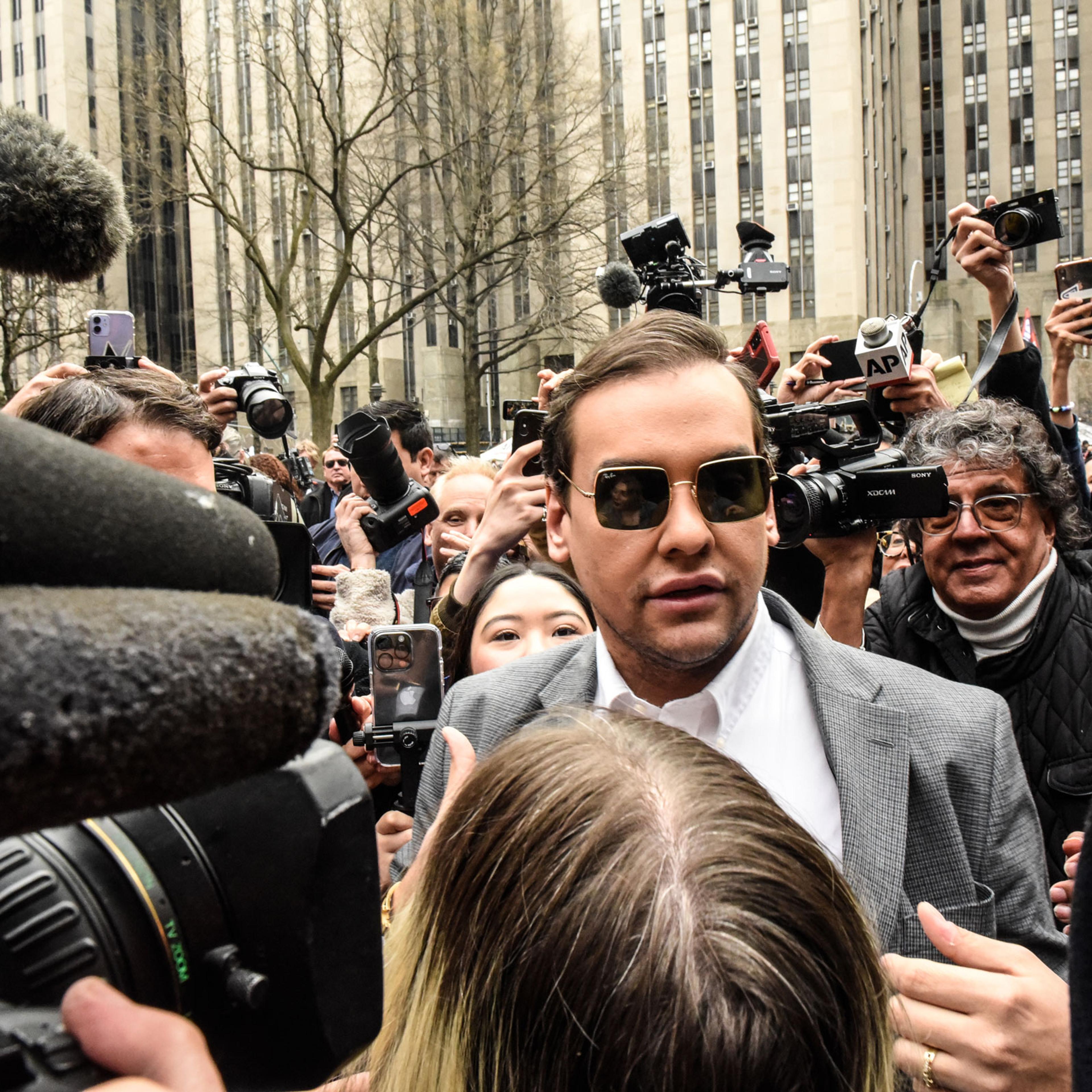 Rep. George Santos, a Republican from New York, speaks to members of the media outside criminal court in New York, on April 4, 2023.