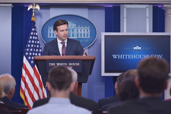 White House Press Secretary Josh Earnest answers questions on the massive cyber-attack on the personal data of government employees June 5, 2015 during the daily briefing in the Brady Briefing Room of the White House in Washington, DC.