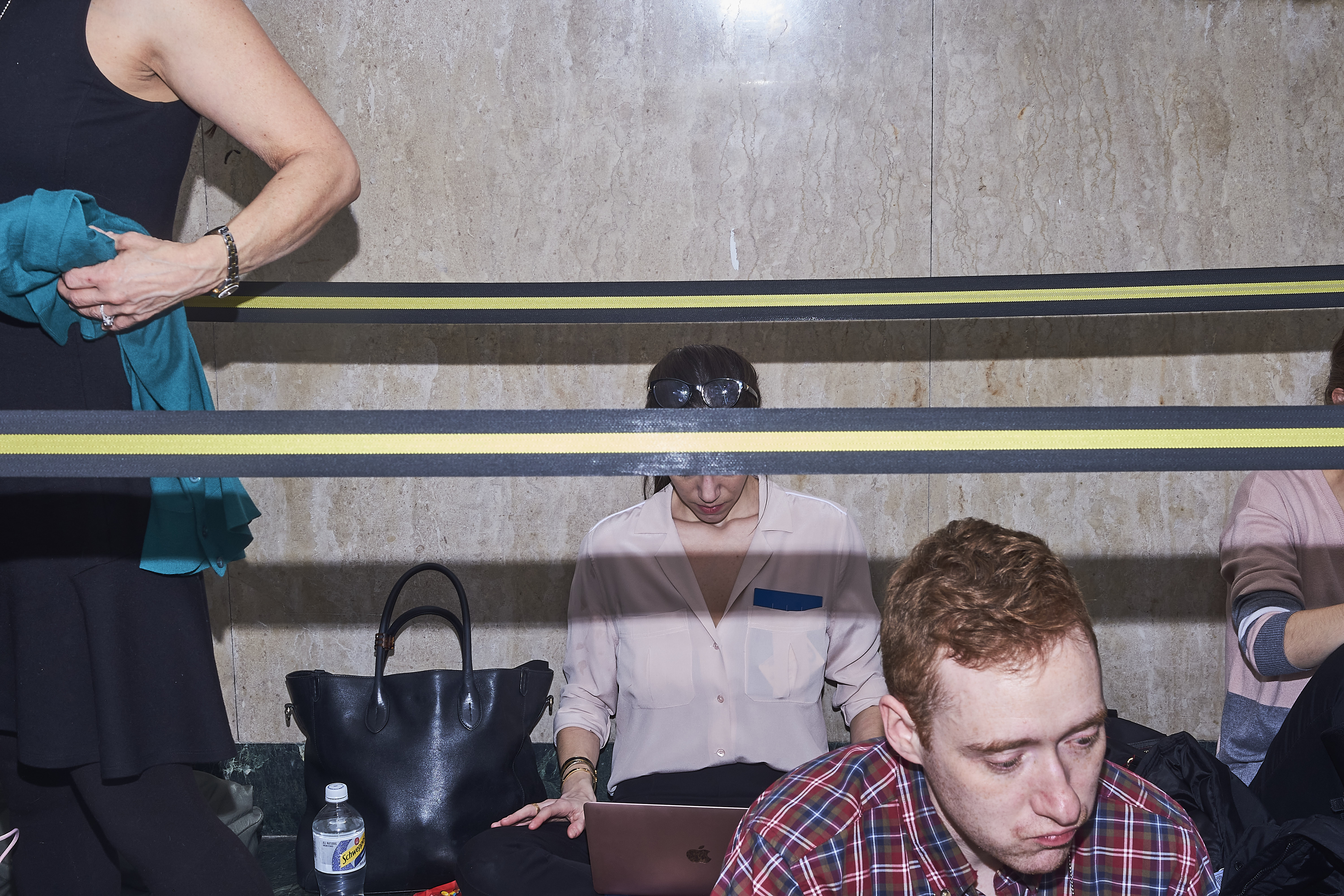 Reporters take a lunch break outside the courtroom on the 15th floor on Jan. 16, 2020.