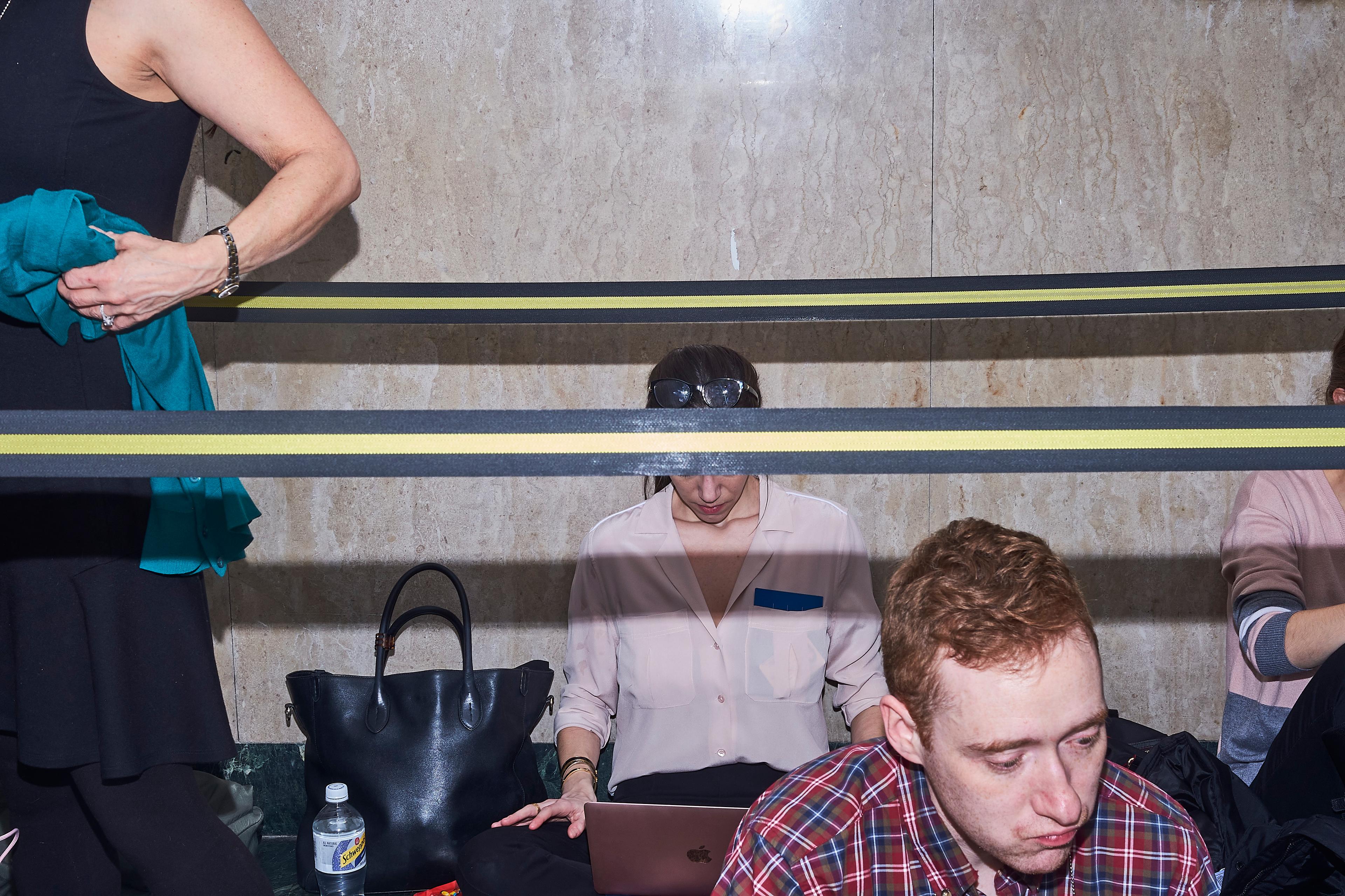 Reporters take a lunch break outside the courtroom on the 15th floor on Jan. 16, 2020.