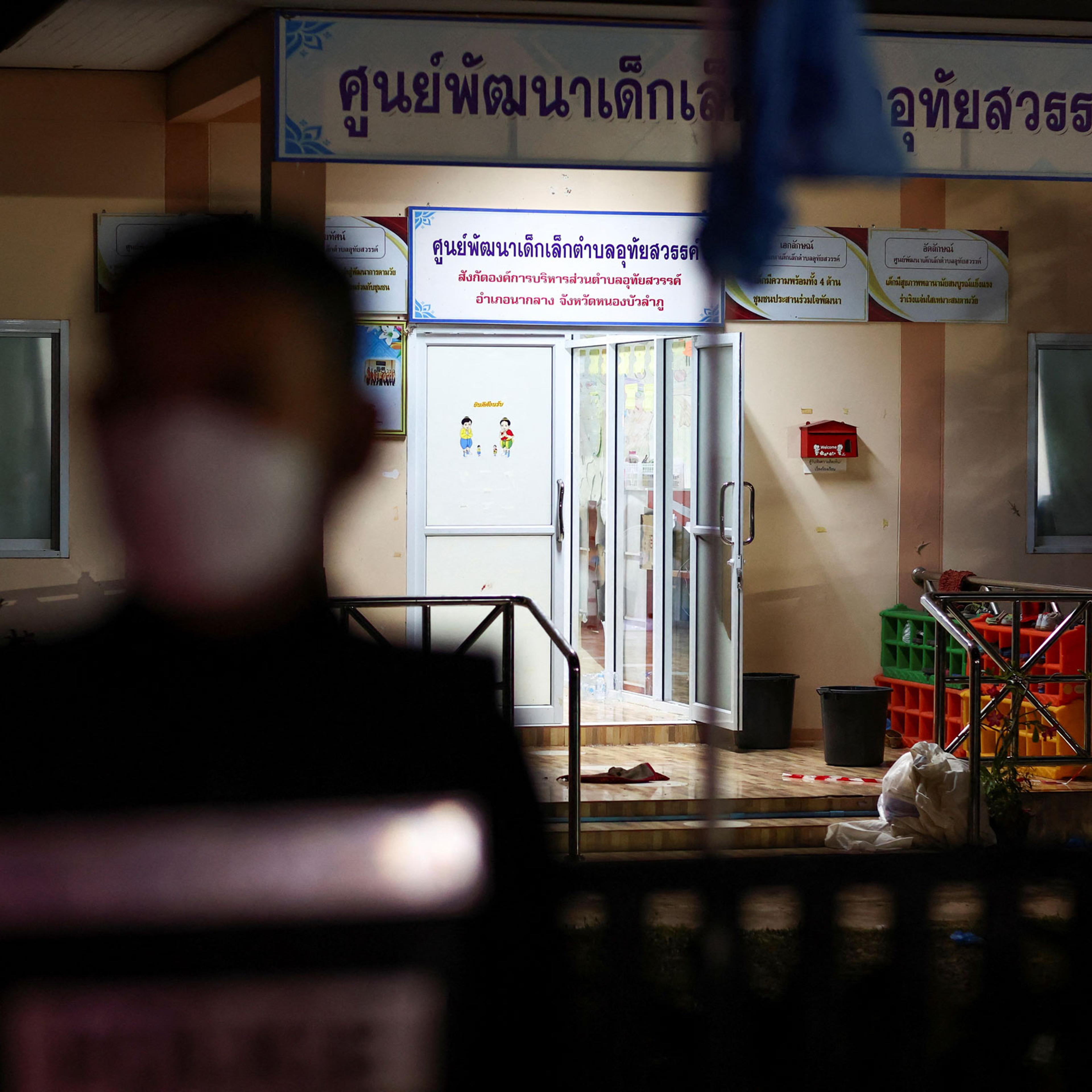 A police officer stands outside a day care center which was the scene of a mass shooting, in the town of Uthai Sawan, around 500 km northeast of Bangkok in the province of Nong Bua Lam Phu, Thailand, on Oct. 6, 2022.