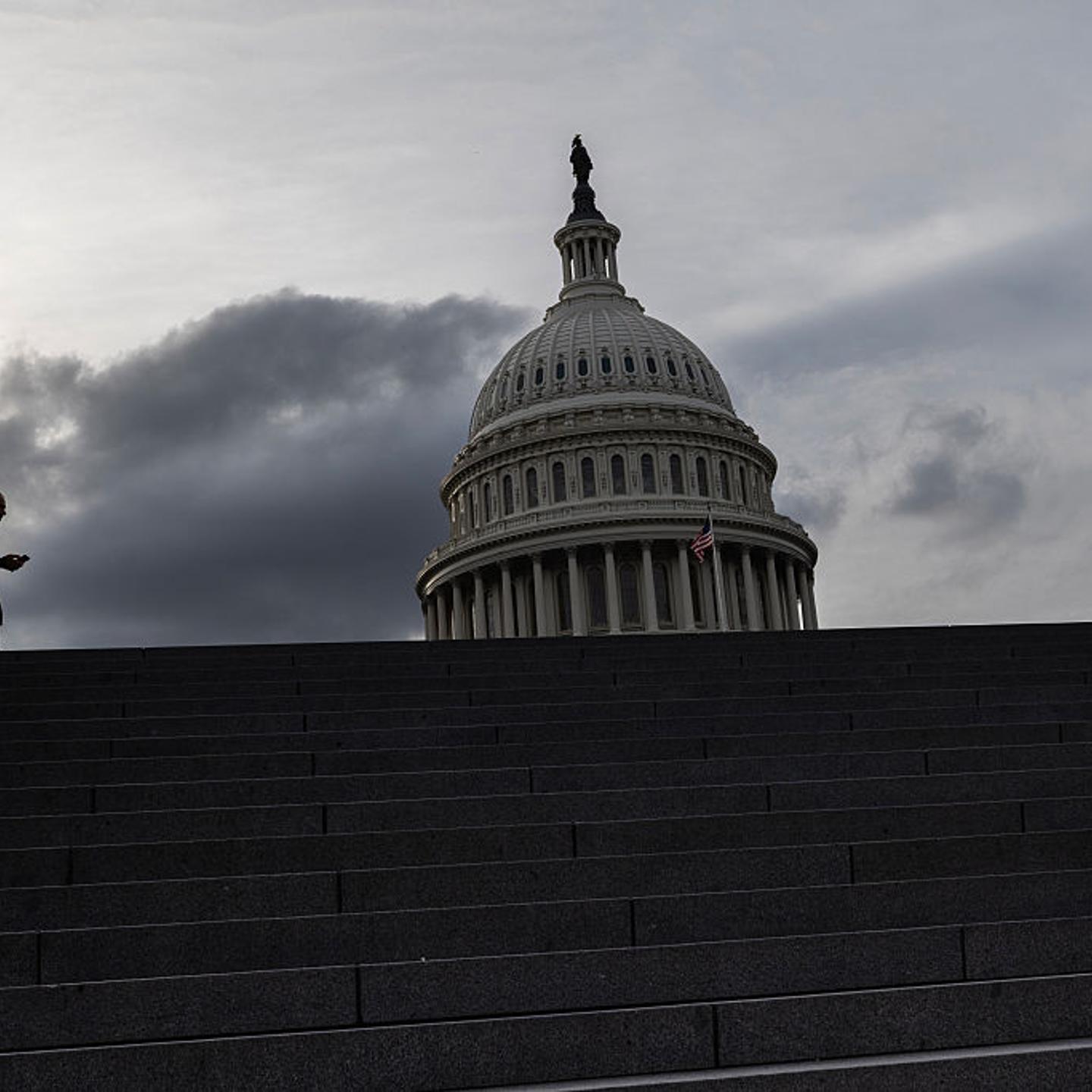 A man walks near the U.S. Capitol, where a political