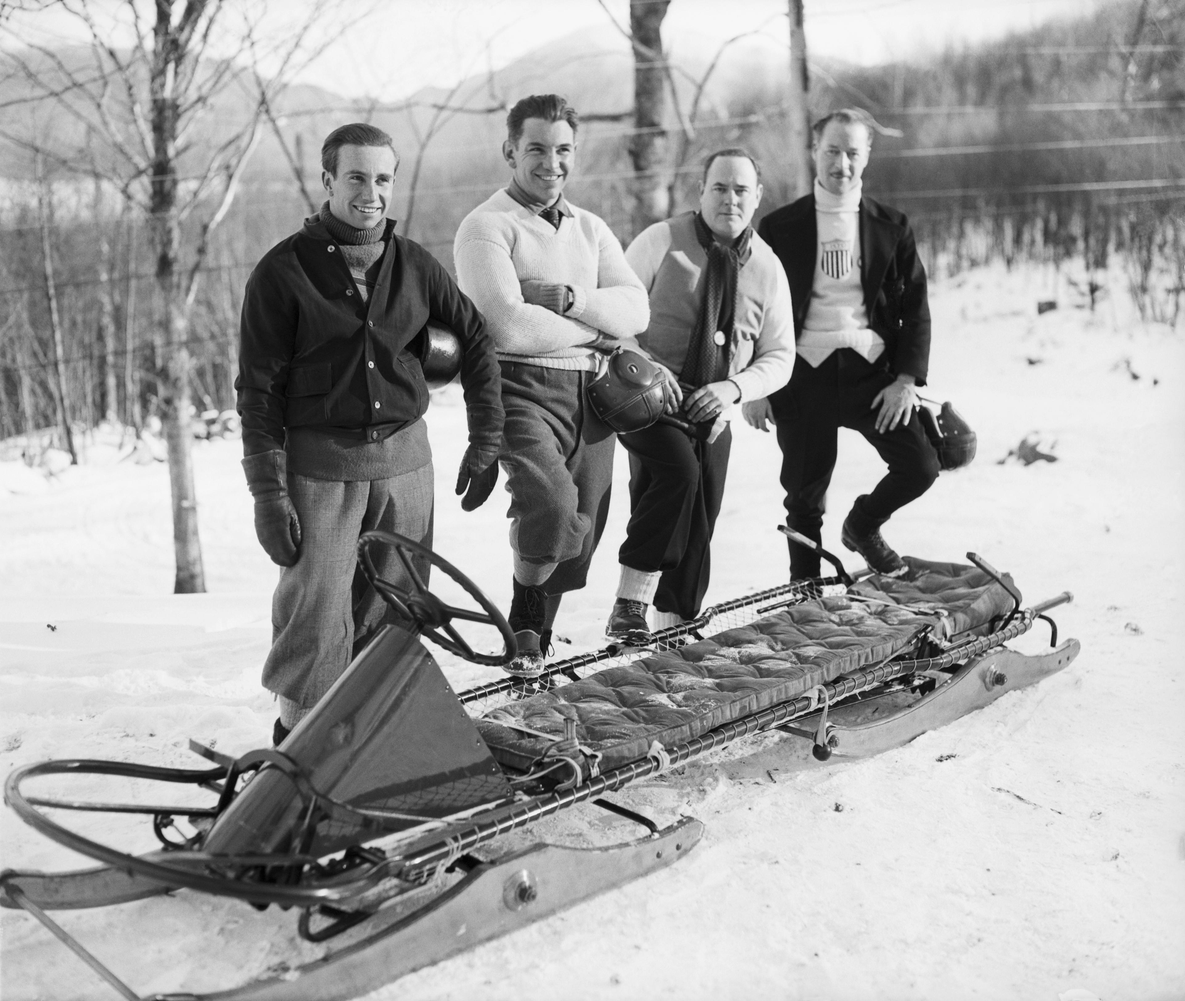 Olympic Bobsled Team In Front Of Bobsled