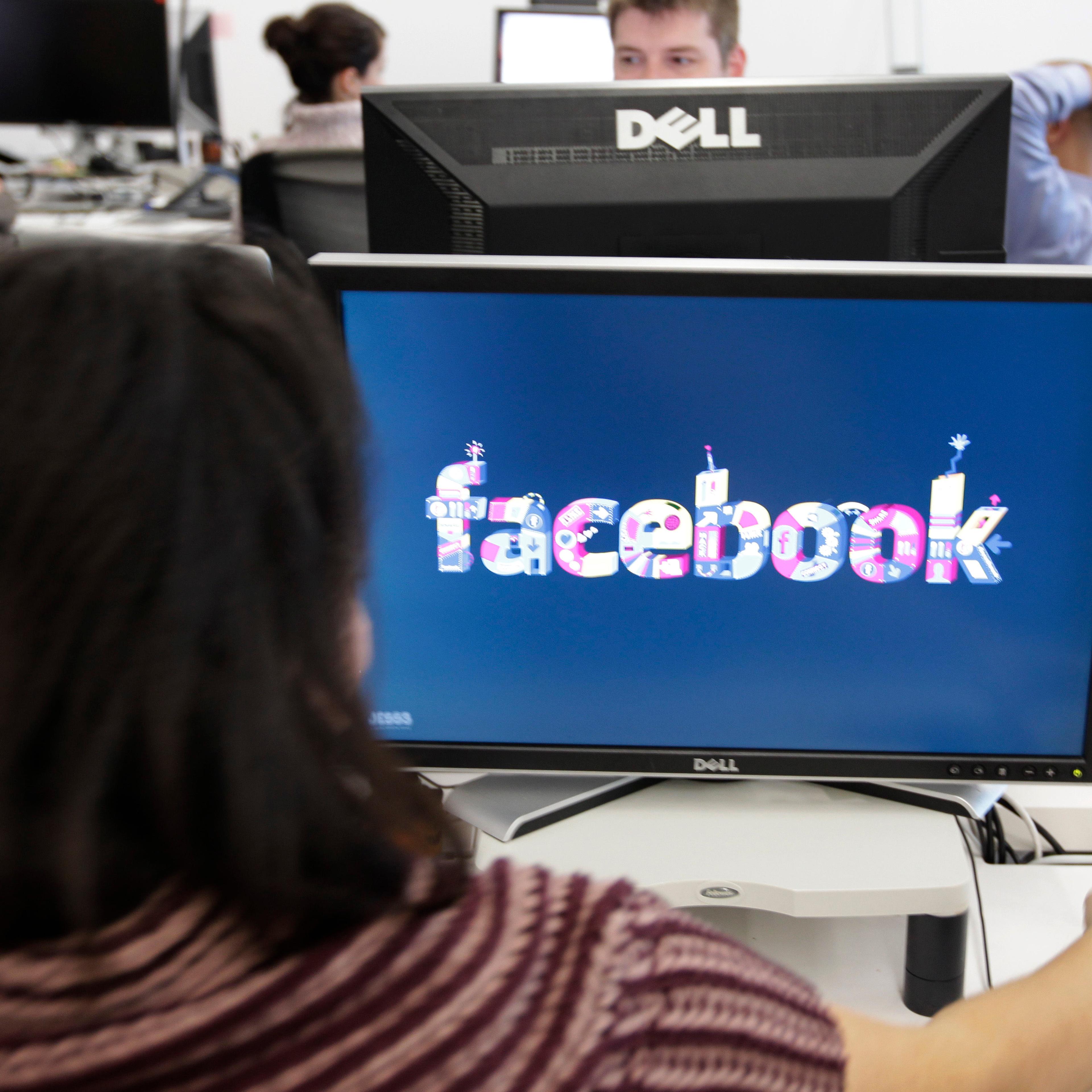 Facebook User Operations Safety Team workers look at reviews at Facebook headquarters in Menlo Park, Calif., Tuesday, Dec. 13, 2011