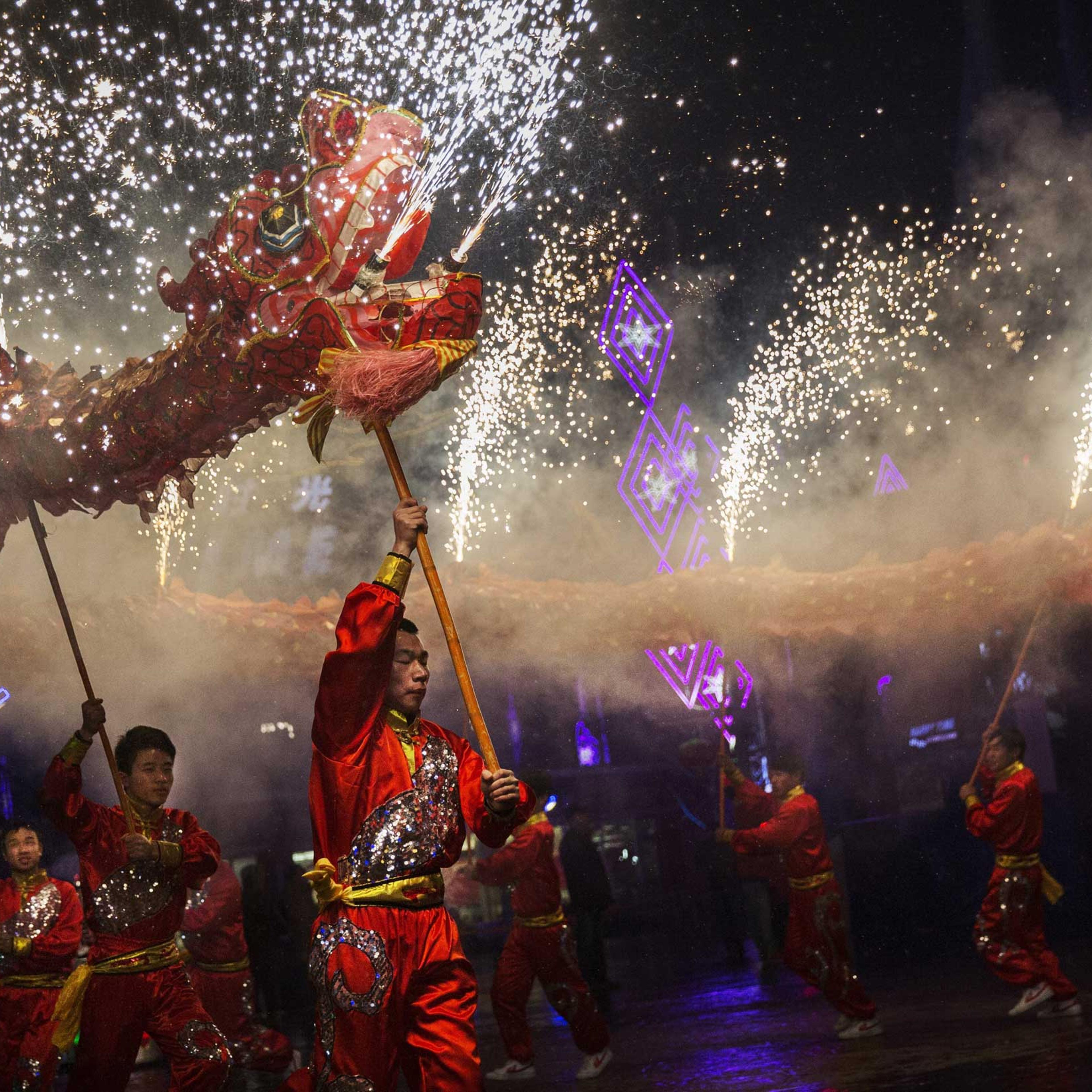 Chinese artists perform a dragon dance at a local amusement park during celebrations for the Lunar New Year, Feb. 19, 2015 in Beijing.