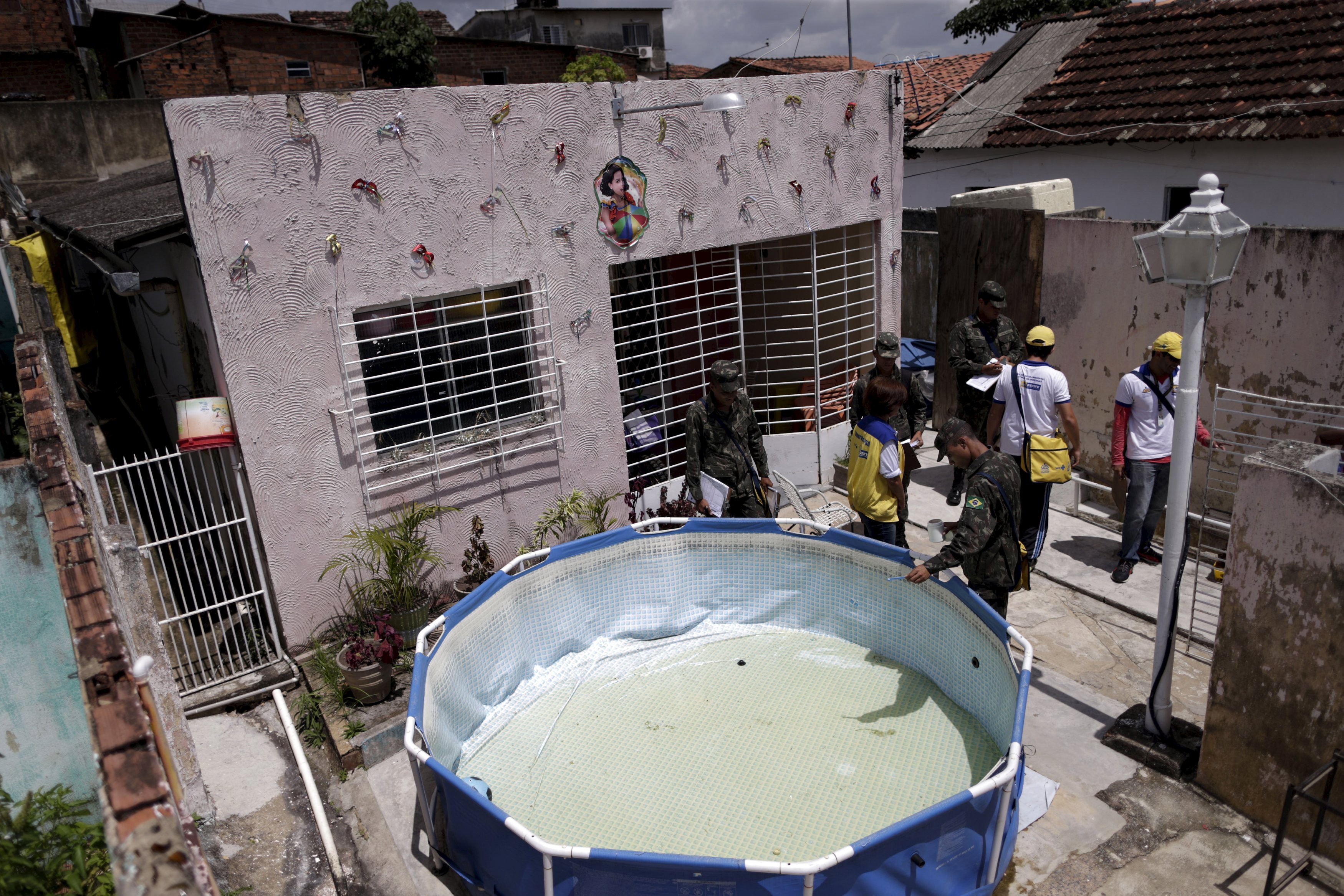 Soldiers inspect a house during an operation against the Aedes aegyti mosquito in Recife, Brazil, Jan. 27, 2016. Health authorities in the state at the center of a Zika outbreak have been overwhelmed by the surge of babies born with microcephaly, a neuro