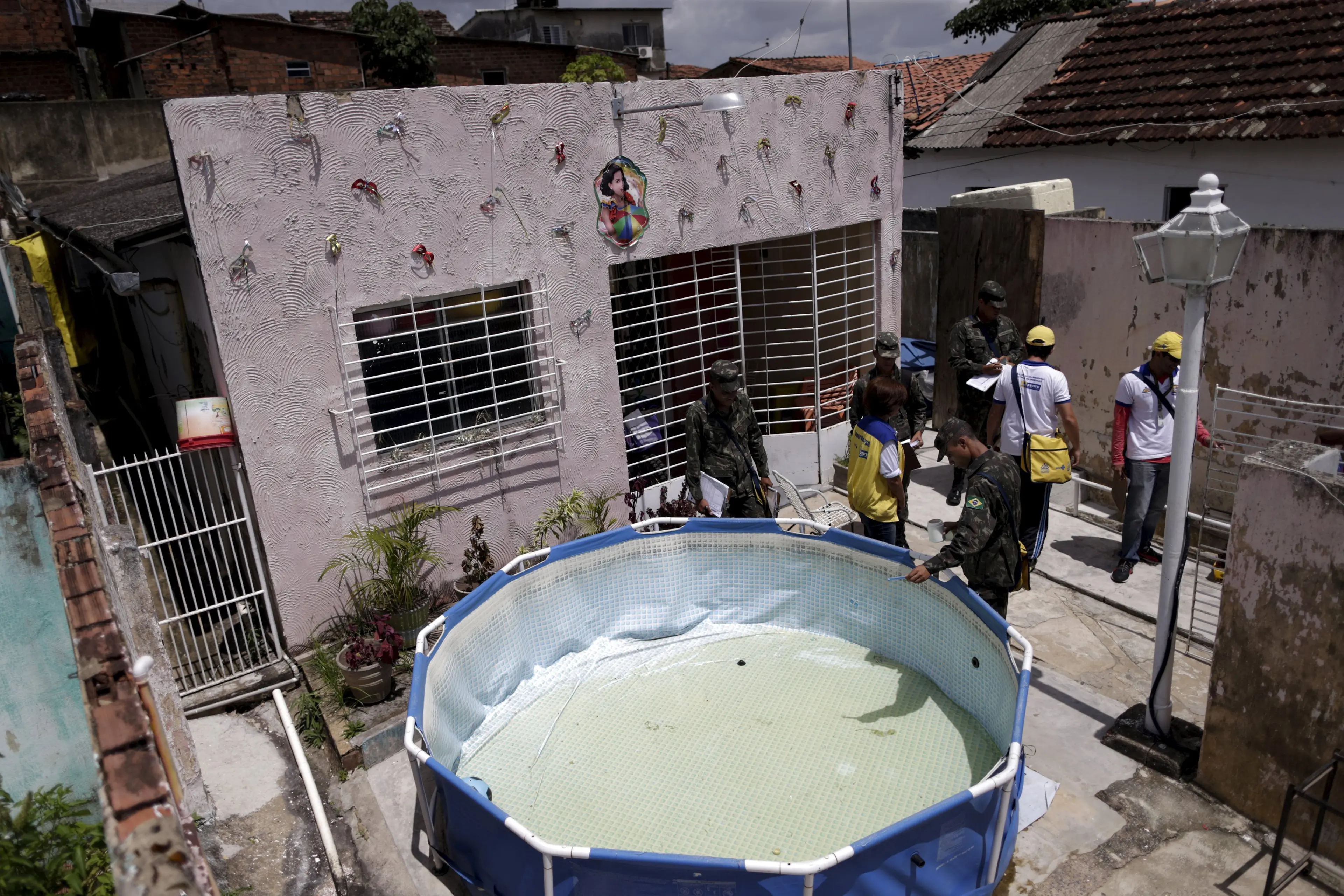 Soldiers inspect a house during an operation against the Aedes aegyti mosquito in Recife, Brazil, Jan. 27, 2016. Health authorities in the state at the center of a Zika outbreak have been overwhelmed by the surge of babies born with microcephaly, a neuro