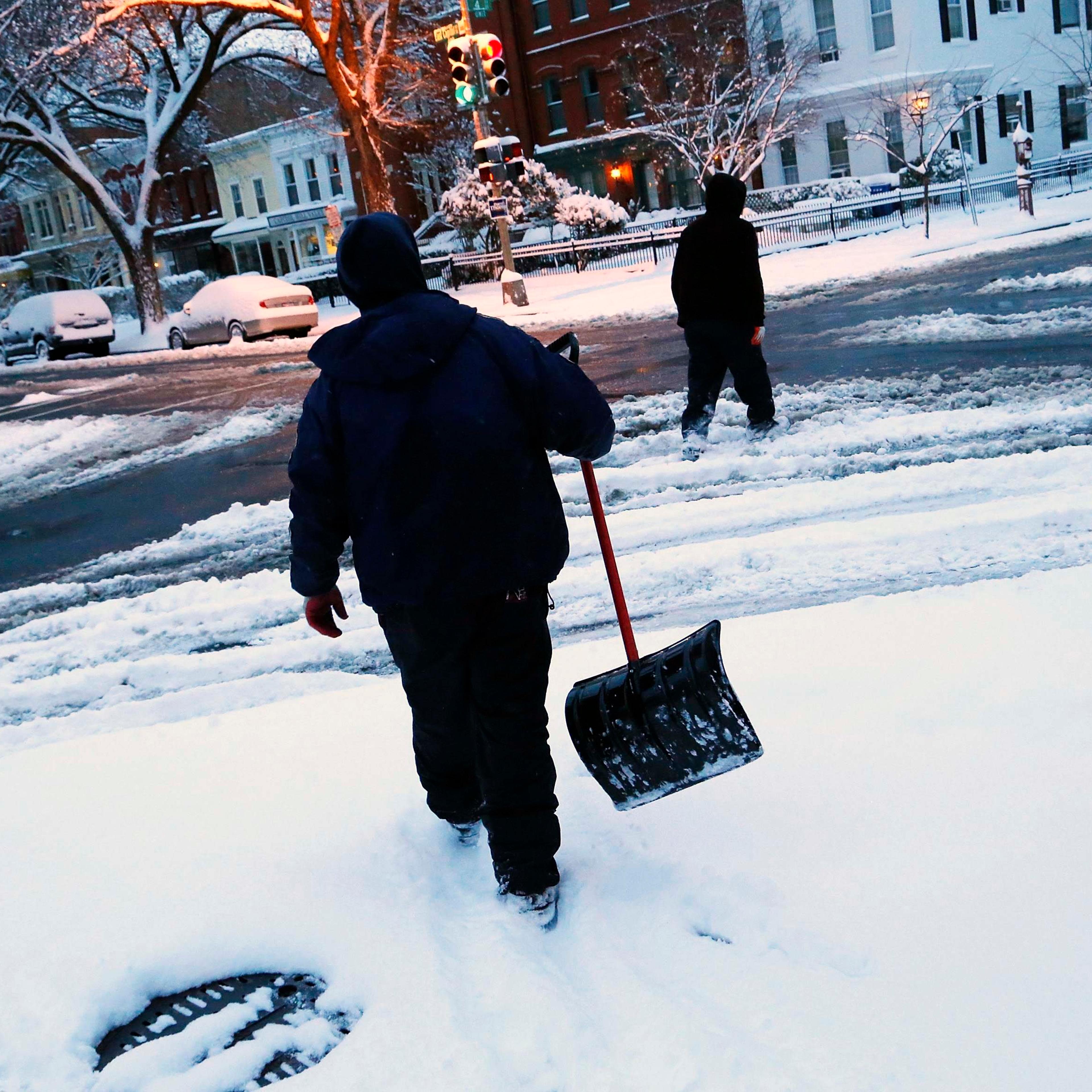 Snow shovelers in the Capitol Hill neighborhood in Washington, D.C., on March 17, 2014.