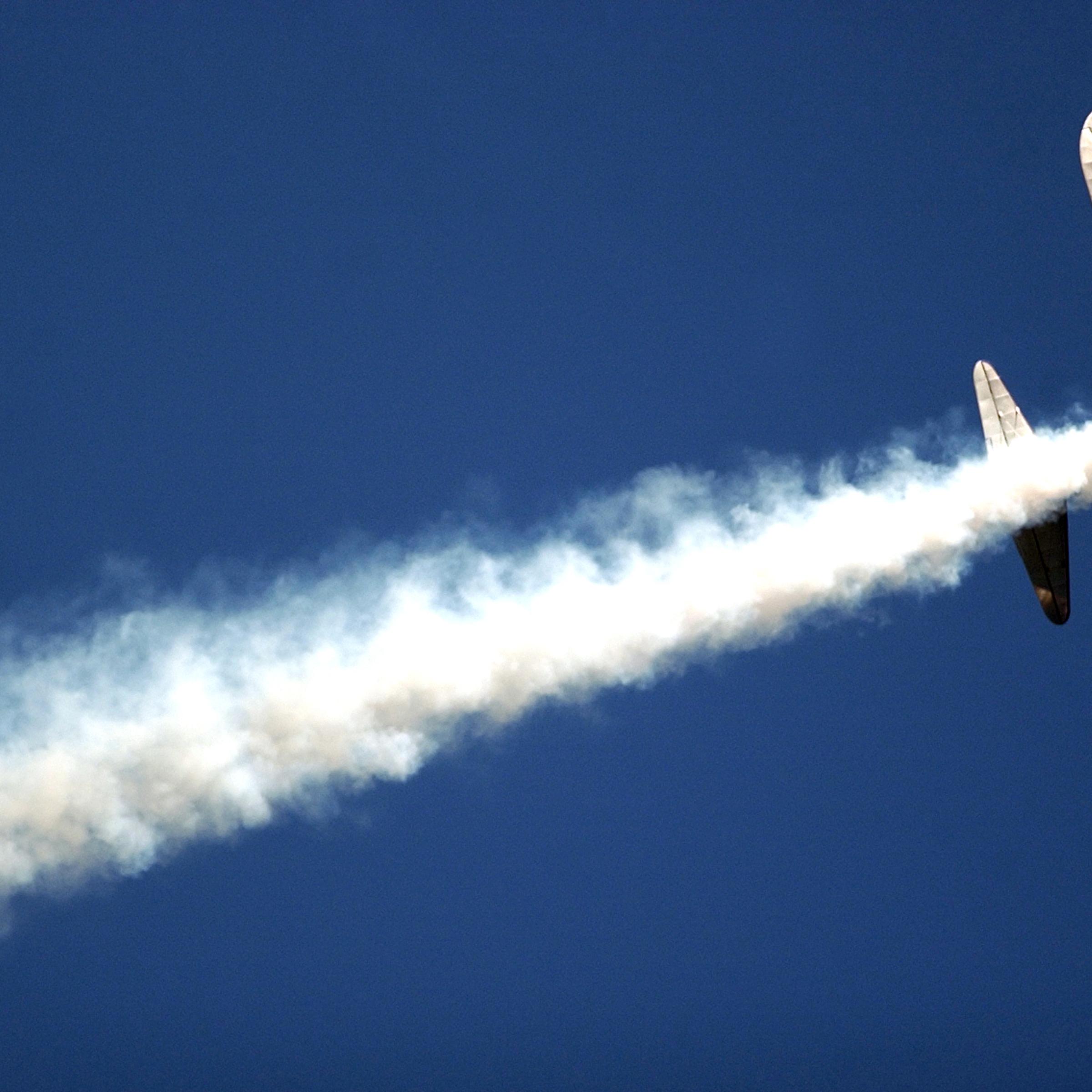 Pilot Eddie Andreini flies his Boeing Stearman over the crowd at Vandenberg Airforce Base, Calif., on Oct. 30, 2004, during the Western Air and Space Show.