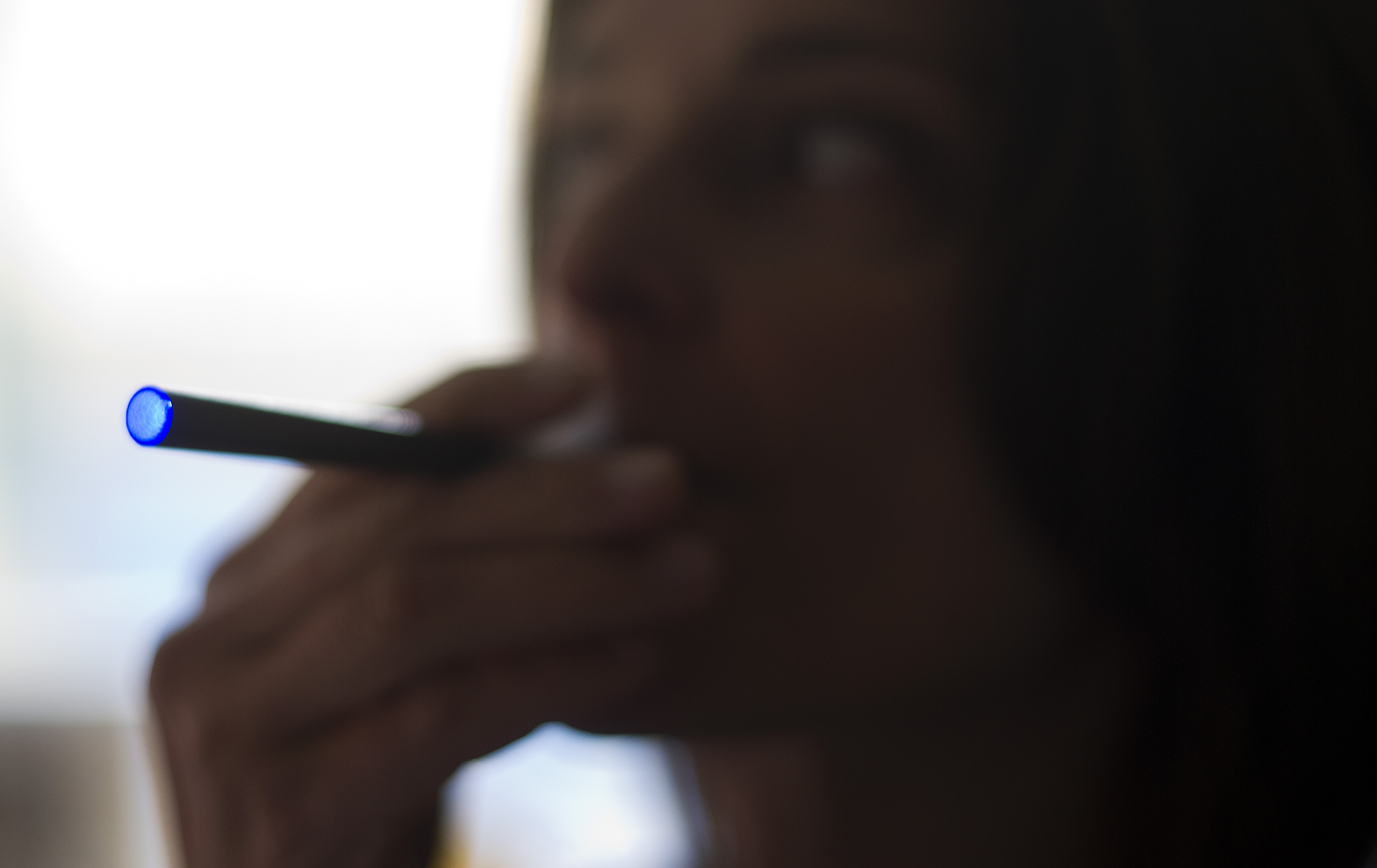 A woman smokes a "Blu" e-cigarette in Washington, D.C., on Sept. 25, 2013.