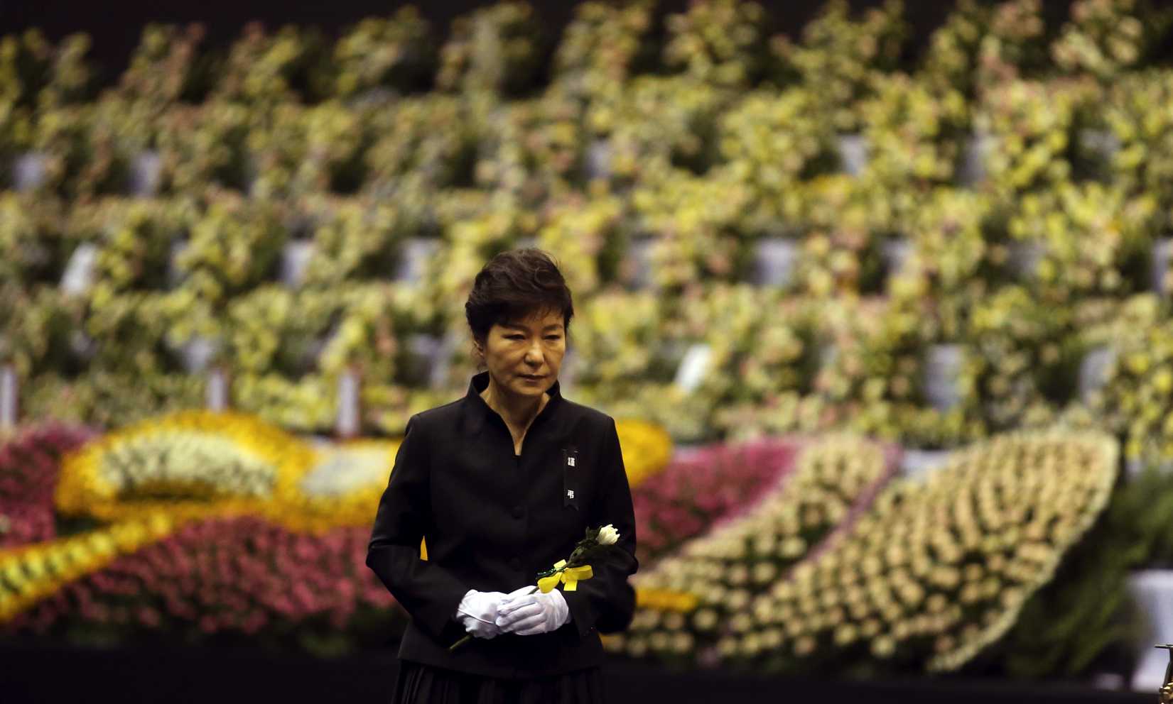 South Korean President Park Geun-hye pays tribute to the victims of the sunken ferry Sewol at a group memorial altar in Ansan, south of Seoul, on Tuesday, April 29, 2014