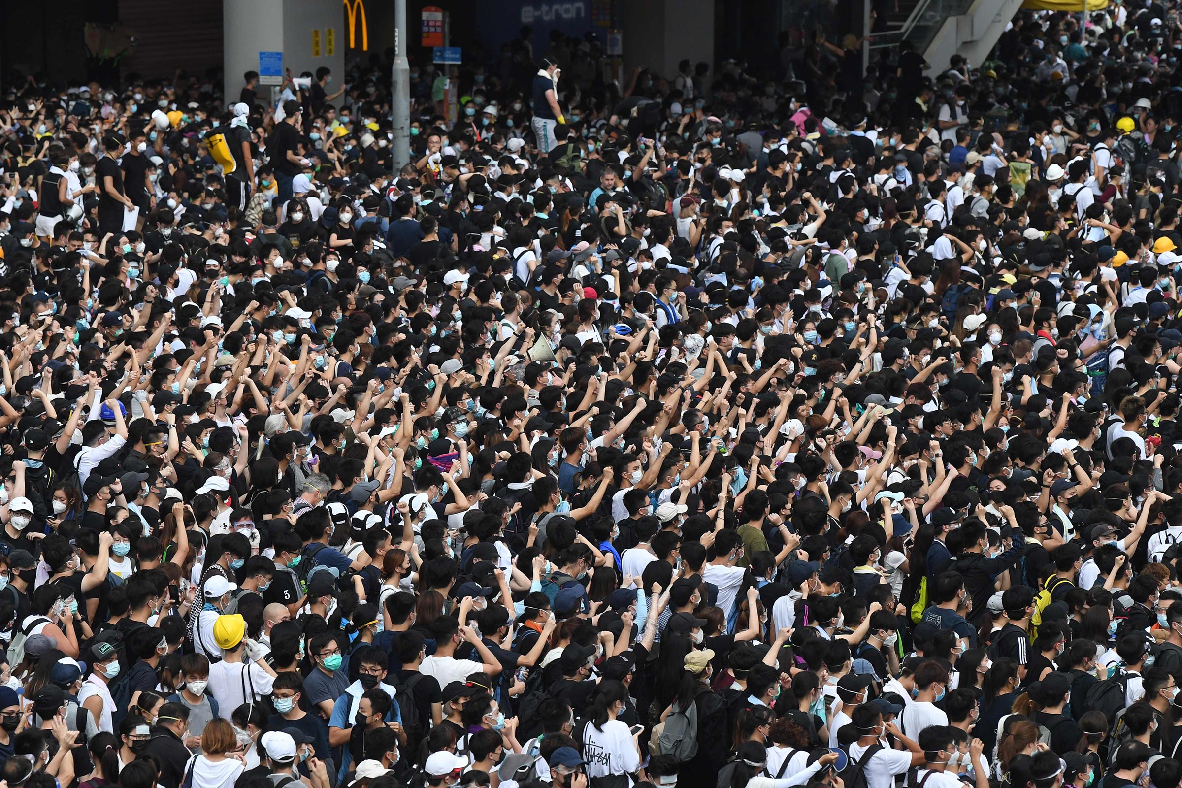 Protesters shout out at police in reaction after police fired tear gas during a rally against a controversial extradition law proposal in Hong Kong on June 12.