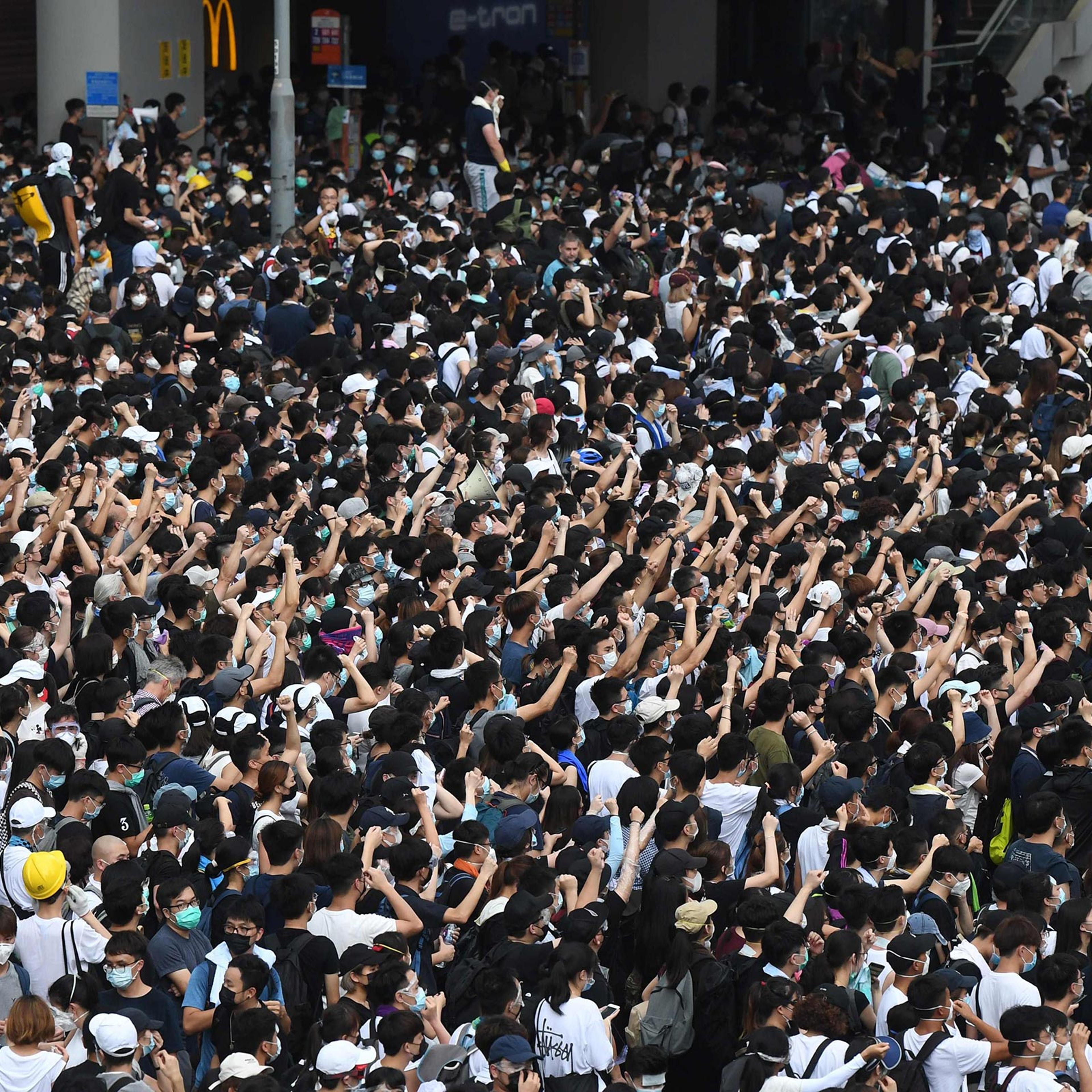 Protesters shout out at police in reaction after police fired tear gas during a rally against a controversial extradition law proposal in Hong Kong on June 12.