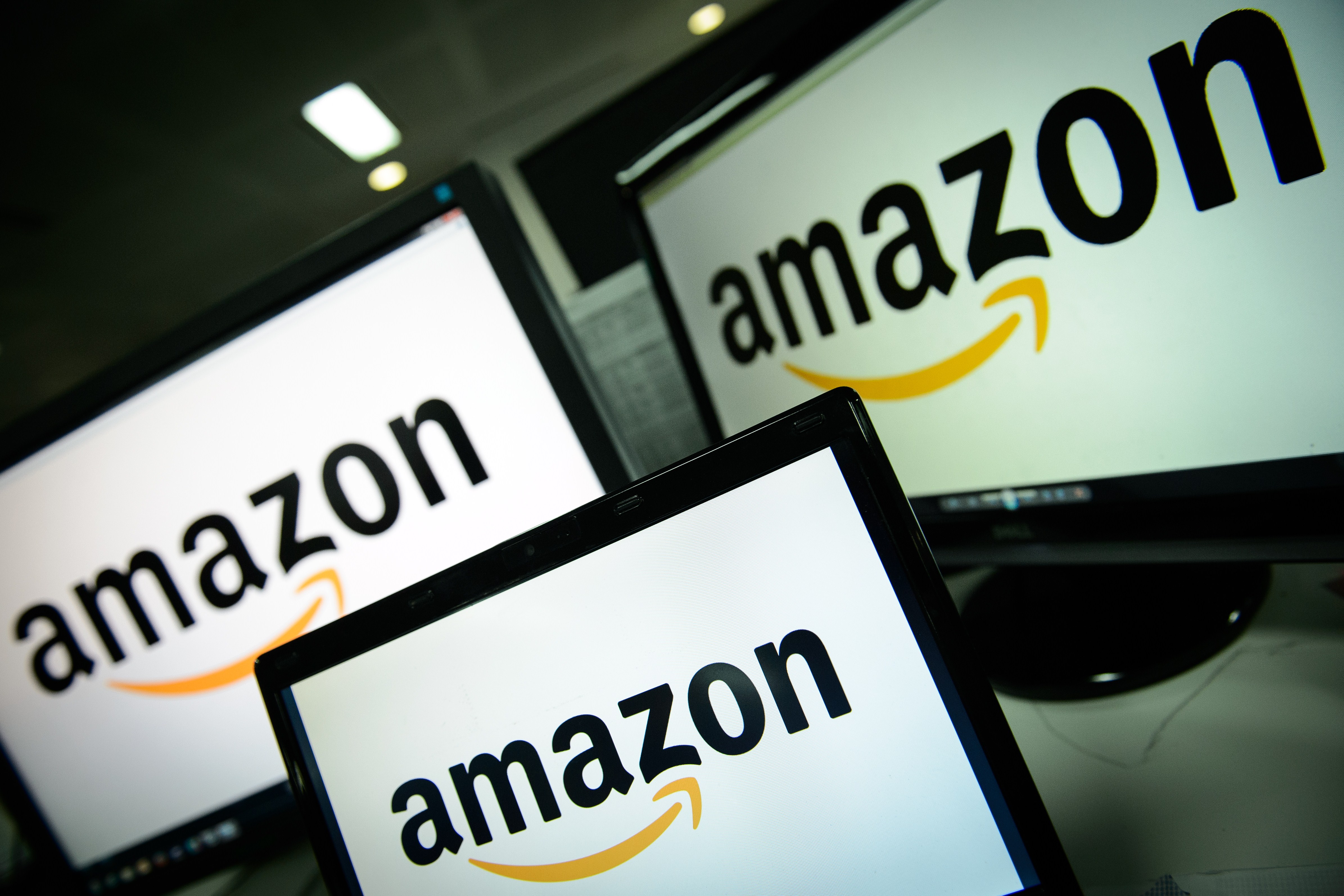 A picture shows the logo of the online retailer Amazon dispalyed on computer screens in London on December 11, 2014.