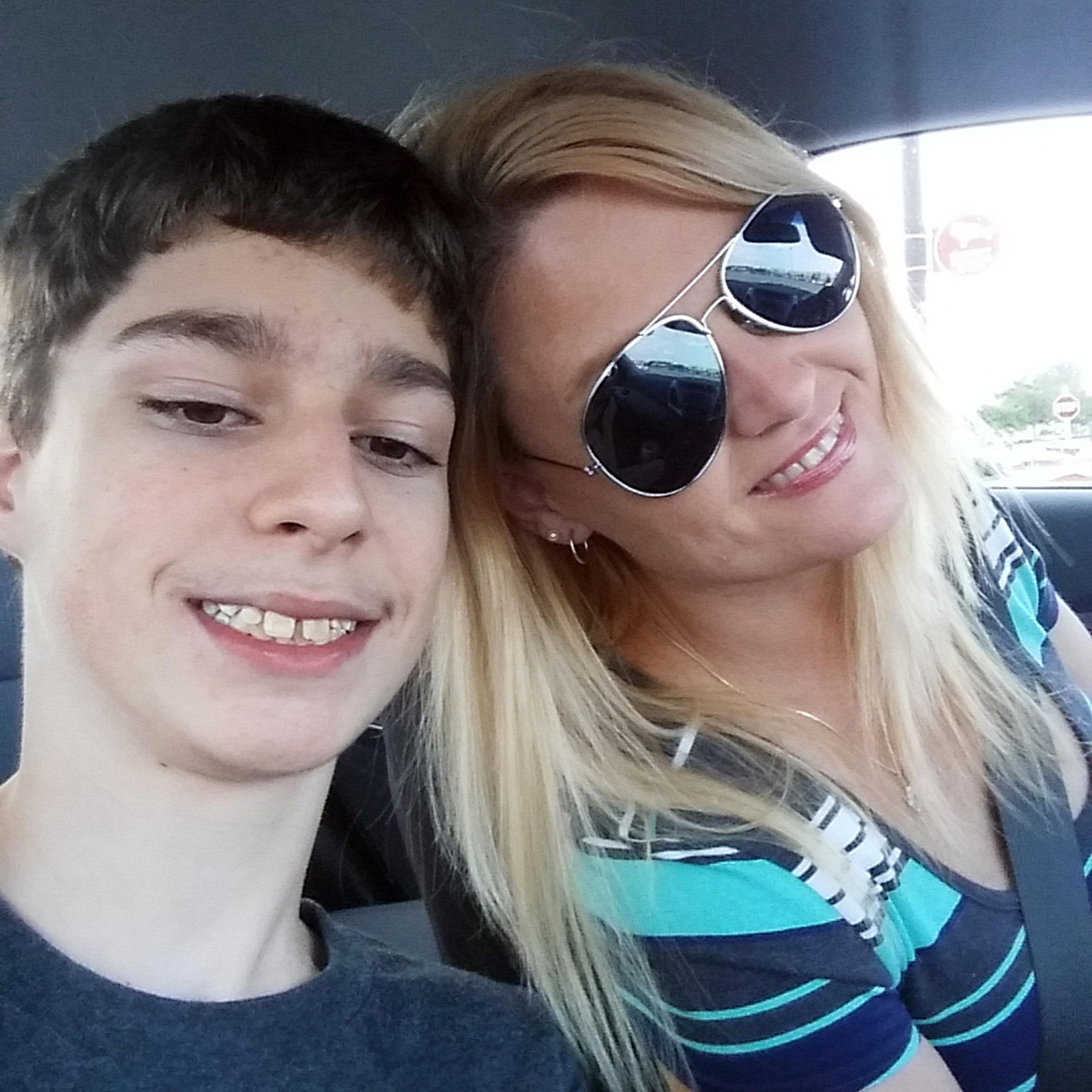In this undated selfie, Alex Hoover, left, poses for a photo with his mother, Rene. Alex Hoover, an Alabama teen with a terminal heart condition has not returned to school after a spate of hospitalizations because of what his mother says is a dispute wit