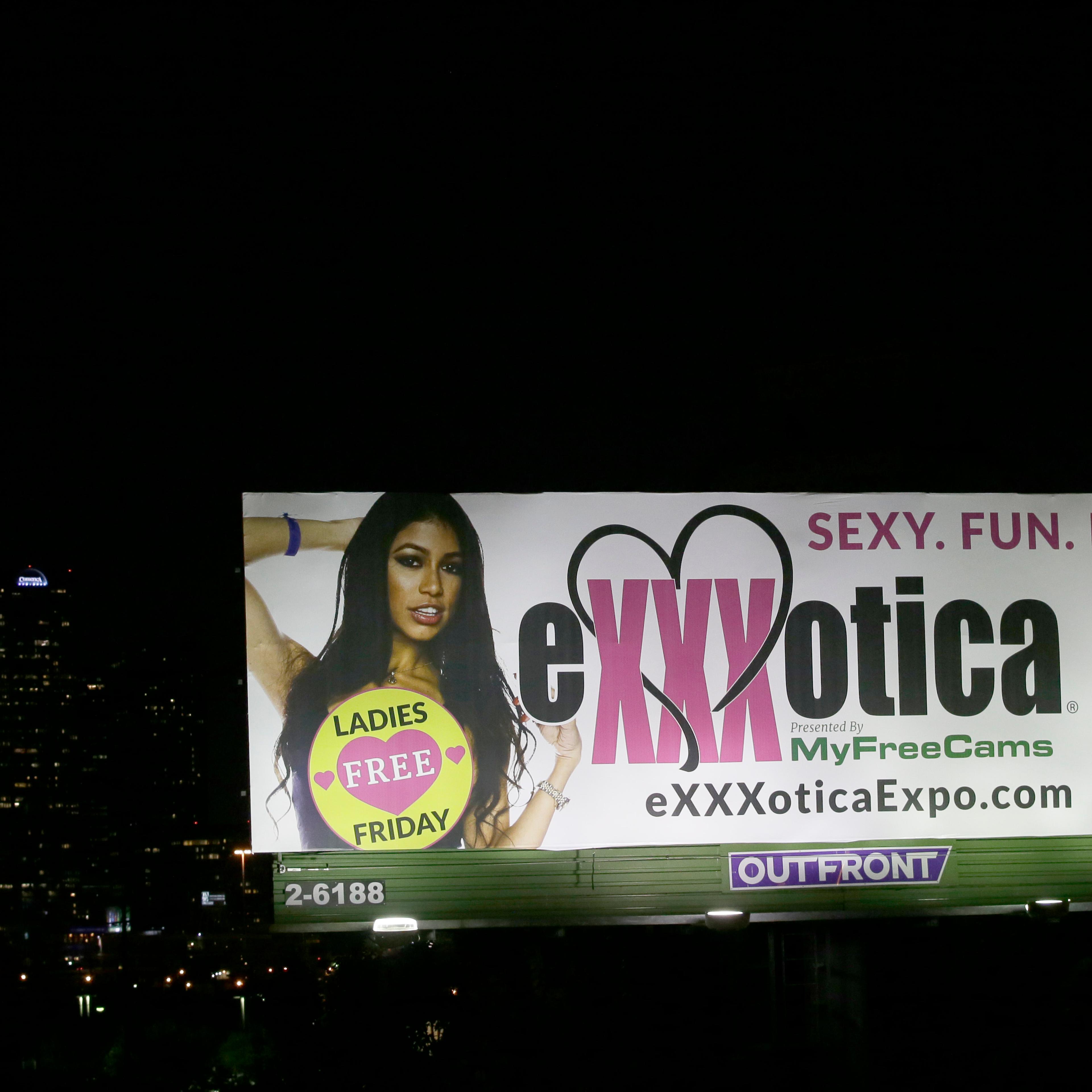 A billboard sign advertises the Exxxotica expo in Dallas, July 31, 2015.