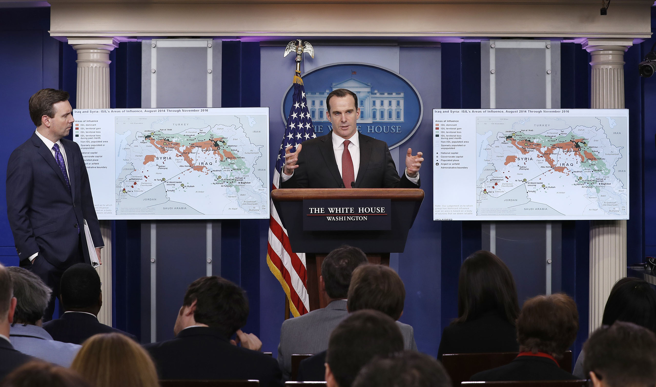 Brett McGurk, White House envoy to the U.S.-led military coalition against the Islamic State group, joined by White House press secretary Josh Earnest, left, speaks about the conflict in Syria during the daily news briefing at the White House in Washingt