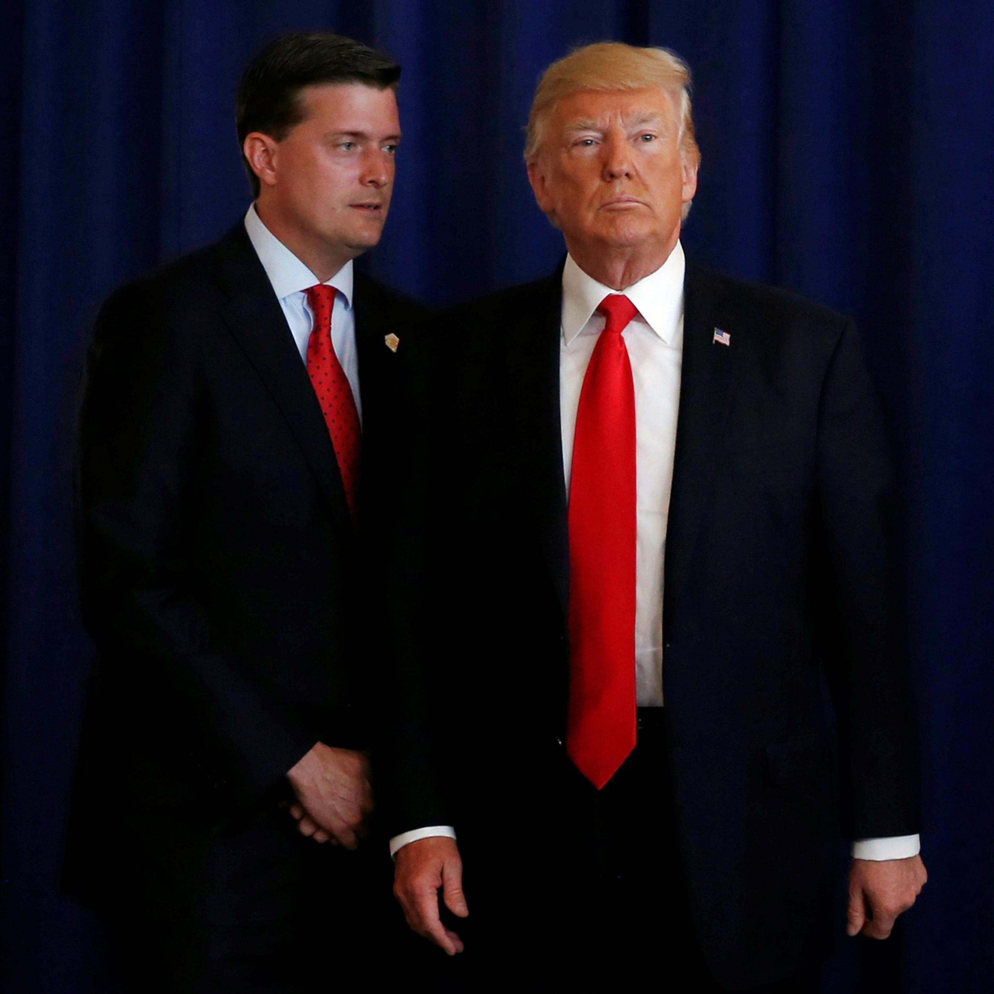 White House Staff Secretary Rob Porter speaks to President Donald Trump at his golf estate in Bedminster, New Jersey, Aug. 12, 2017.