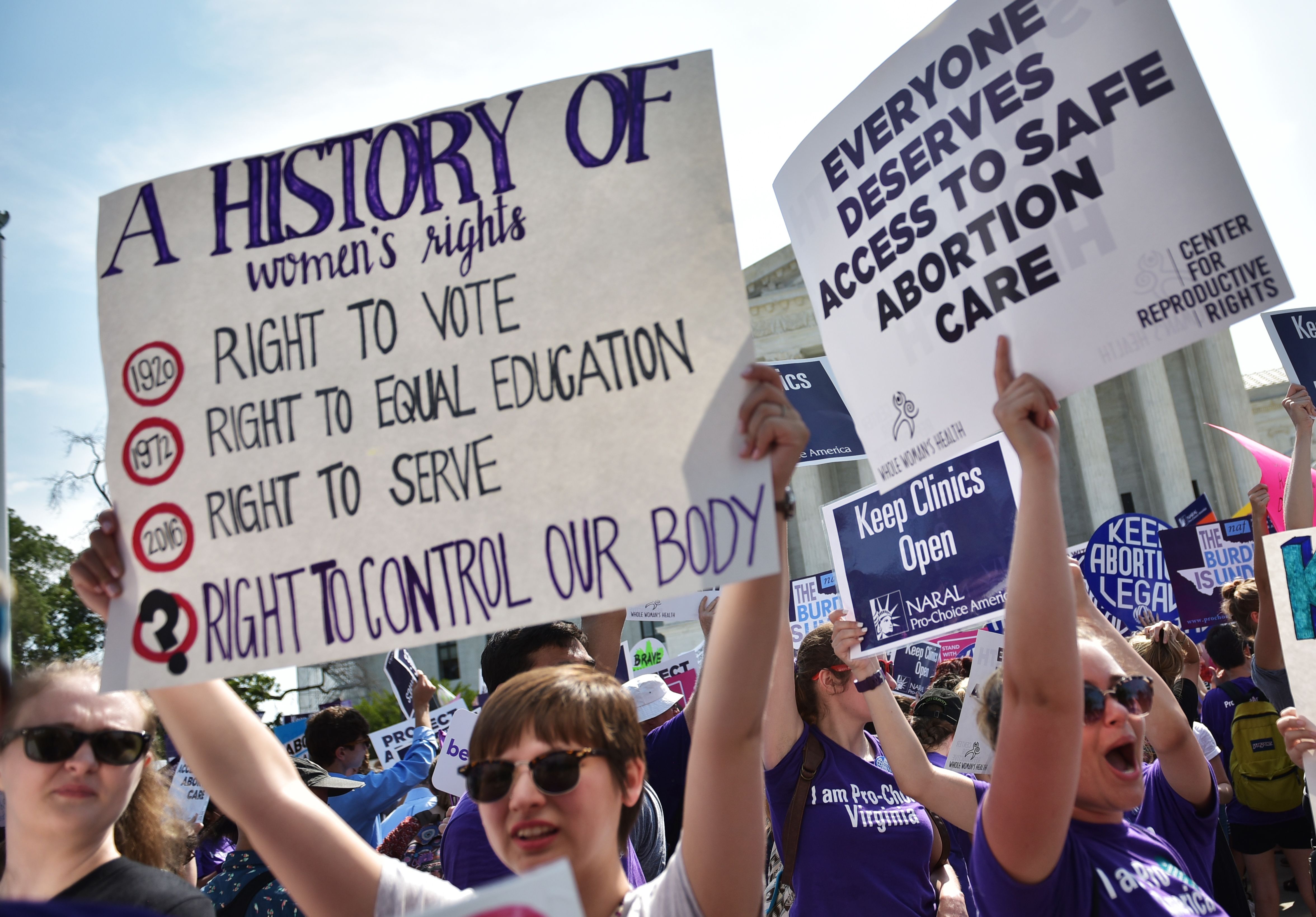 Abortion rights activists cheer after the US Supreme Court struck down a Texas law placing restrictions on abortion clinics, outside of the Supreme Court on June 27, 2016 .