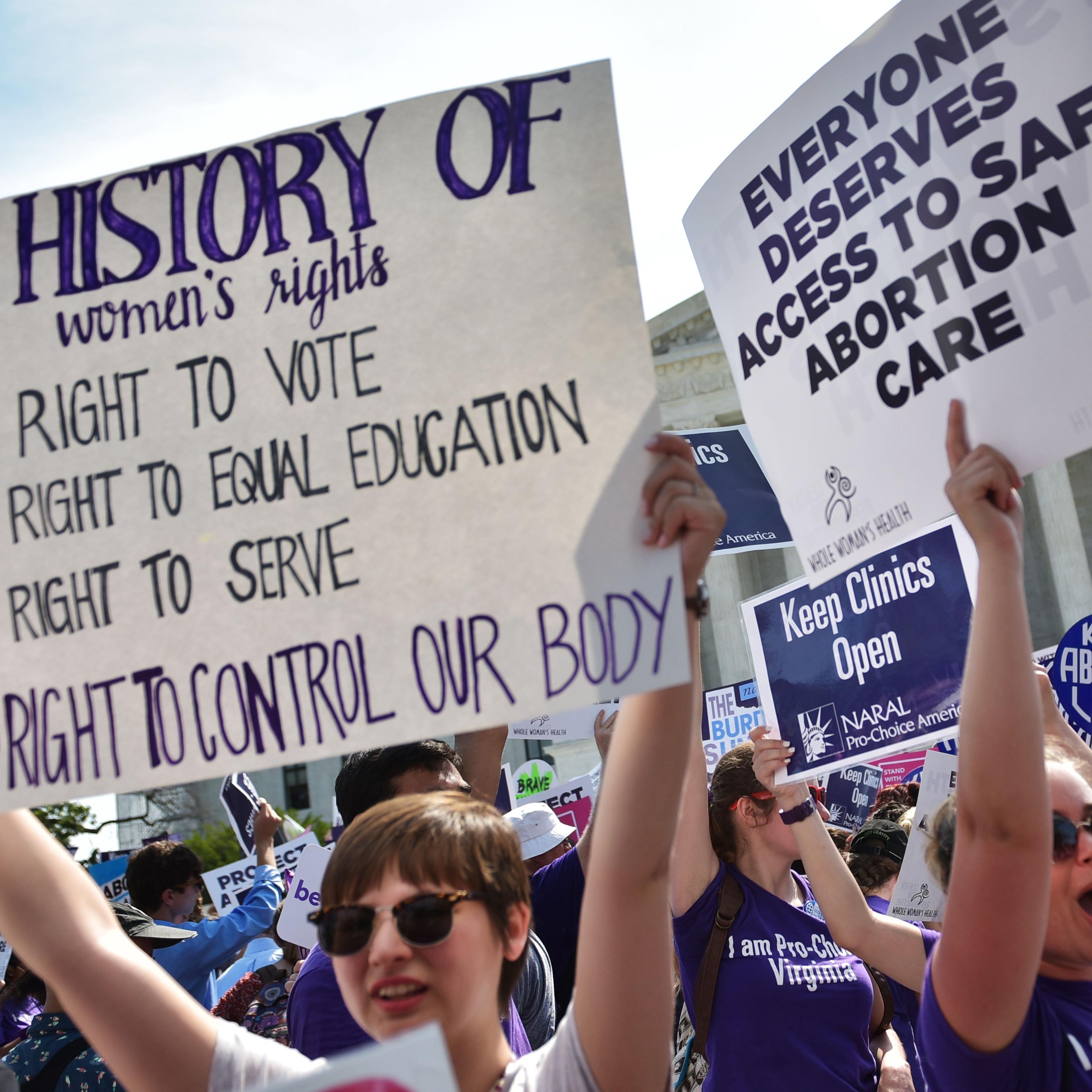 Abortion rights activists cheer after the US Supreme Court struck down a Texas law placing restrictions on abortion clinics, outside of the Supreme Court on June 27, 2016 .