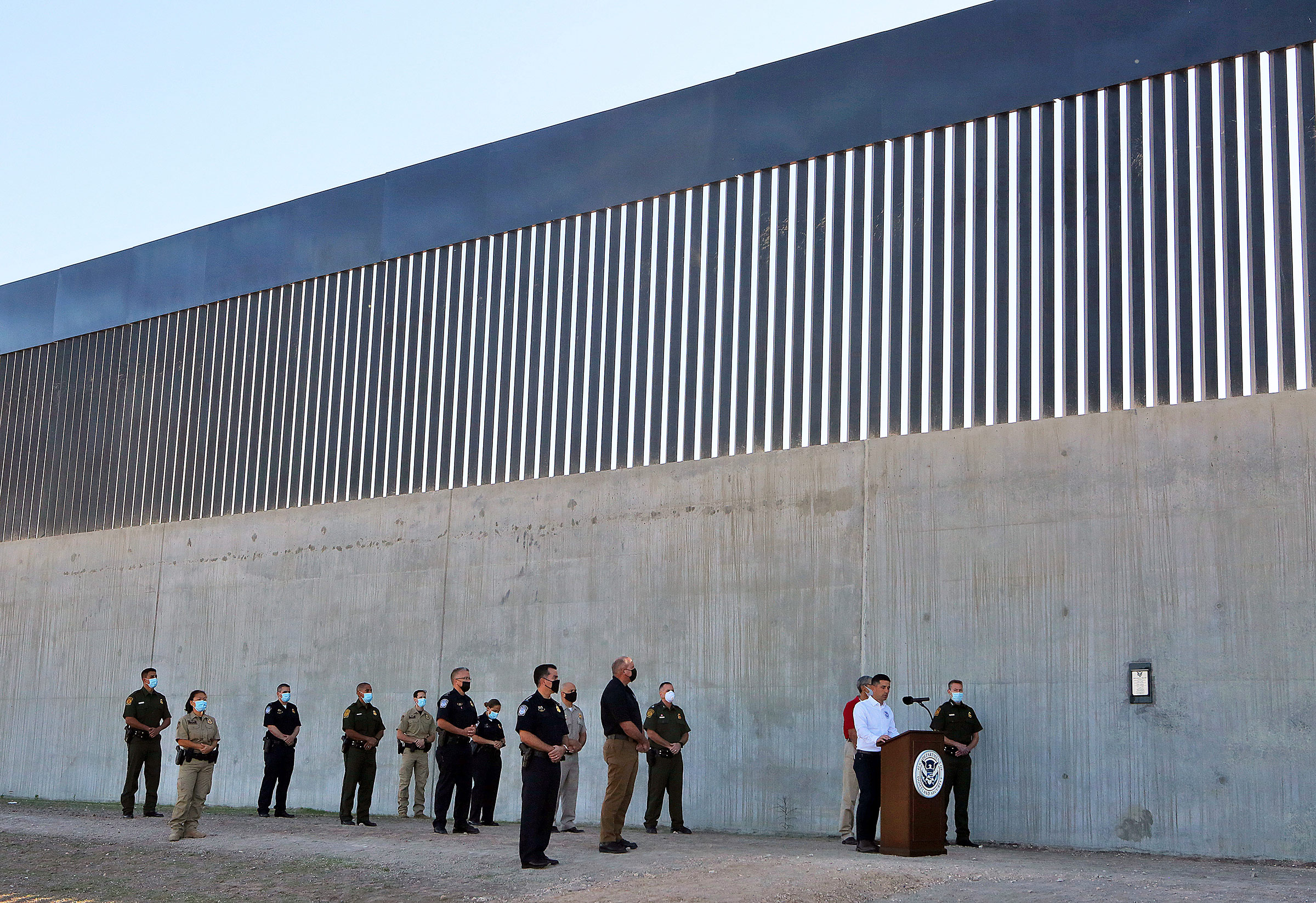 Acting Homeland Secretary Chad Wolf gives a speech in front of a new section of the border wall Thursday, Oct. 29, 2020, in McAllen, Texas. 