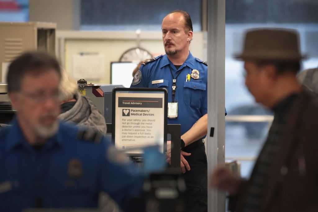 TSA Agents Work At Airport Security As Government Shutdown Continues