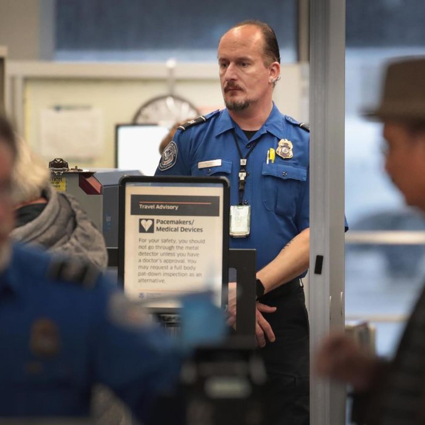 TSA Agents Work At Airport Security As Government Shutdown Continues
