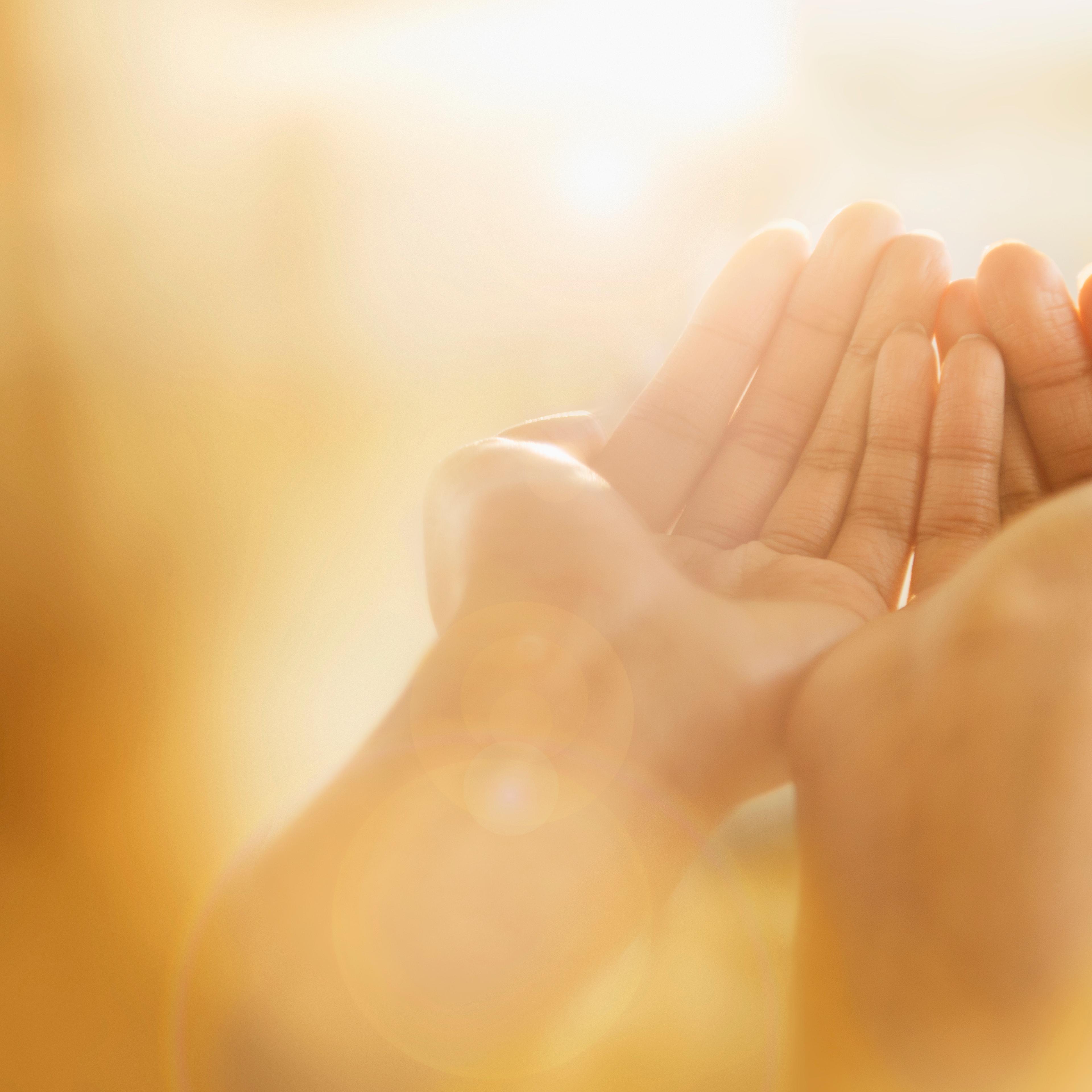 Mixed race woman holding out cupped hands